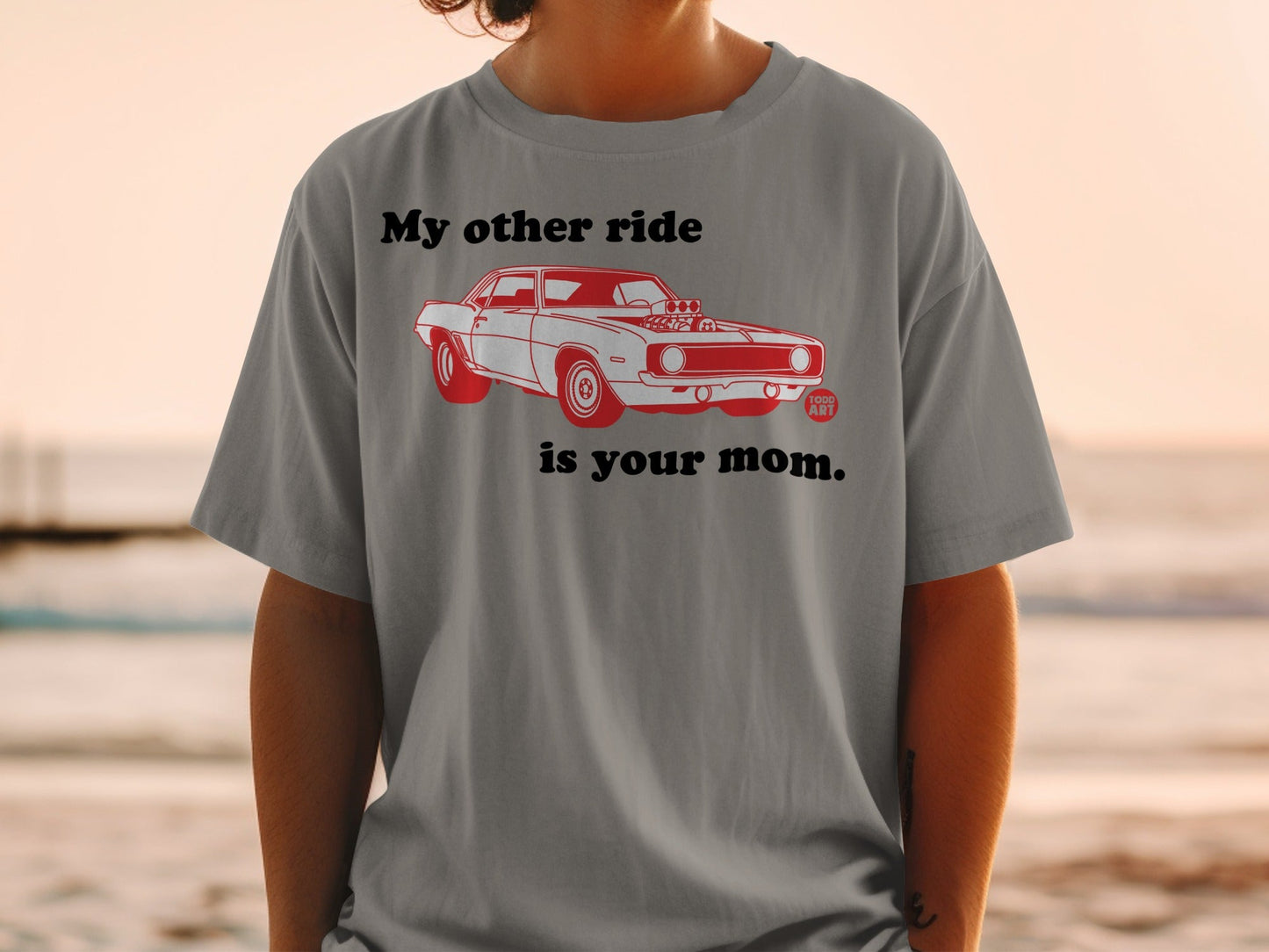 T-shirt with red graphic of a classic car and text "My other ride is your mom."