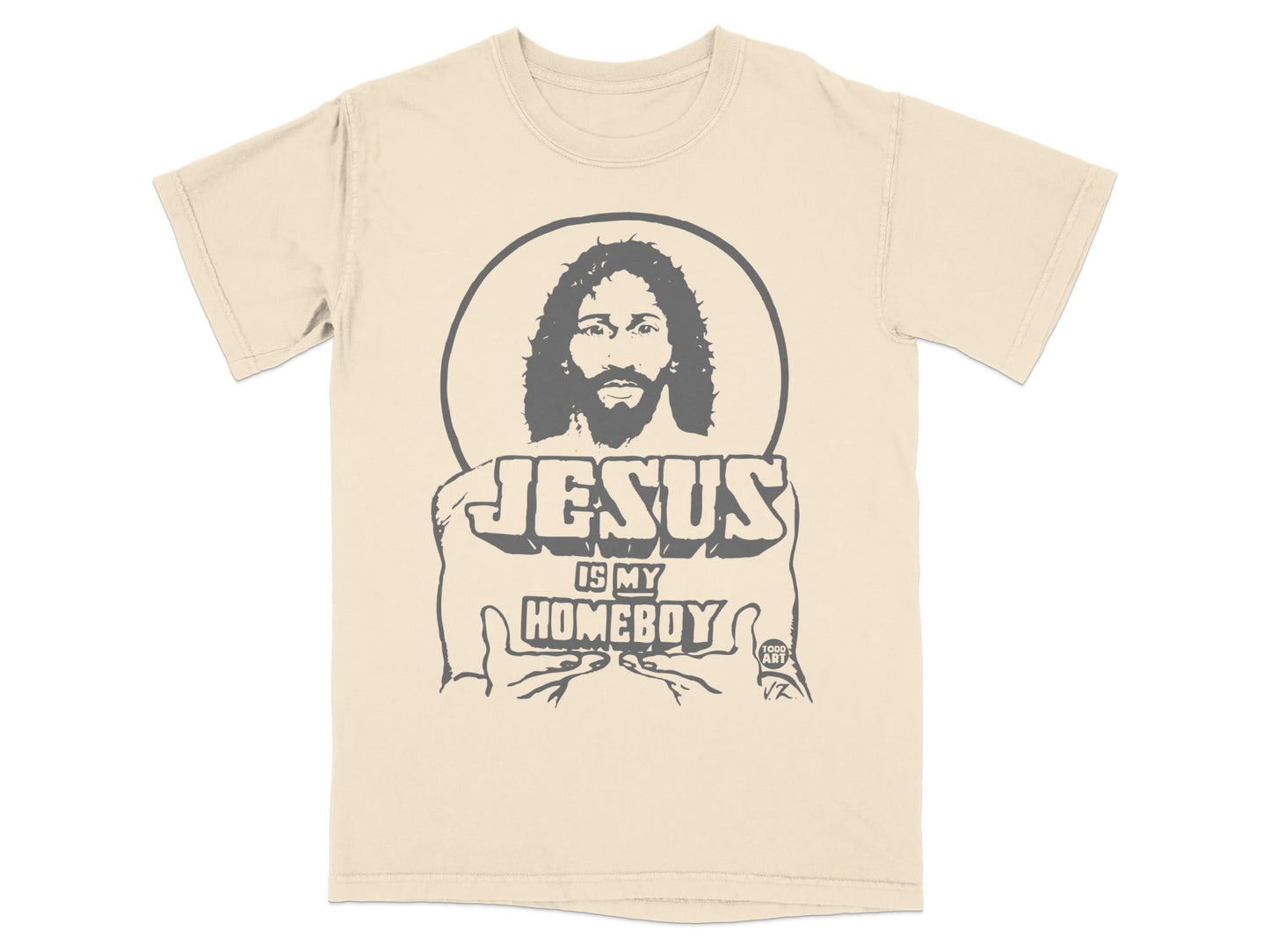Beige t-shirt with a graphic of Jesus holding text that reads "JESUS IS MY HOMEBOY".