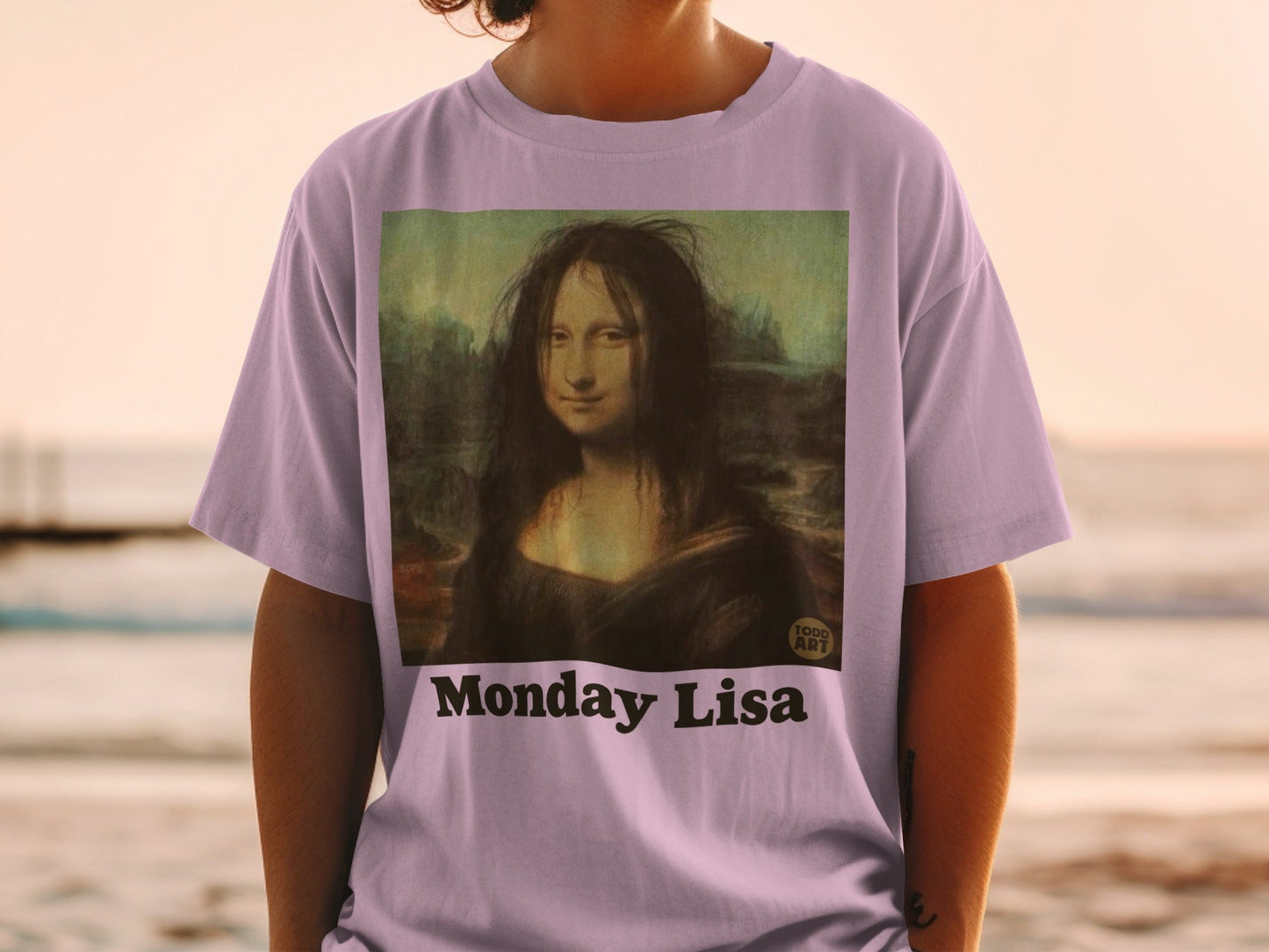 T-shirt with "Monday Lisa" text and Mona Lisa painting.