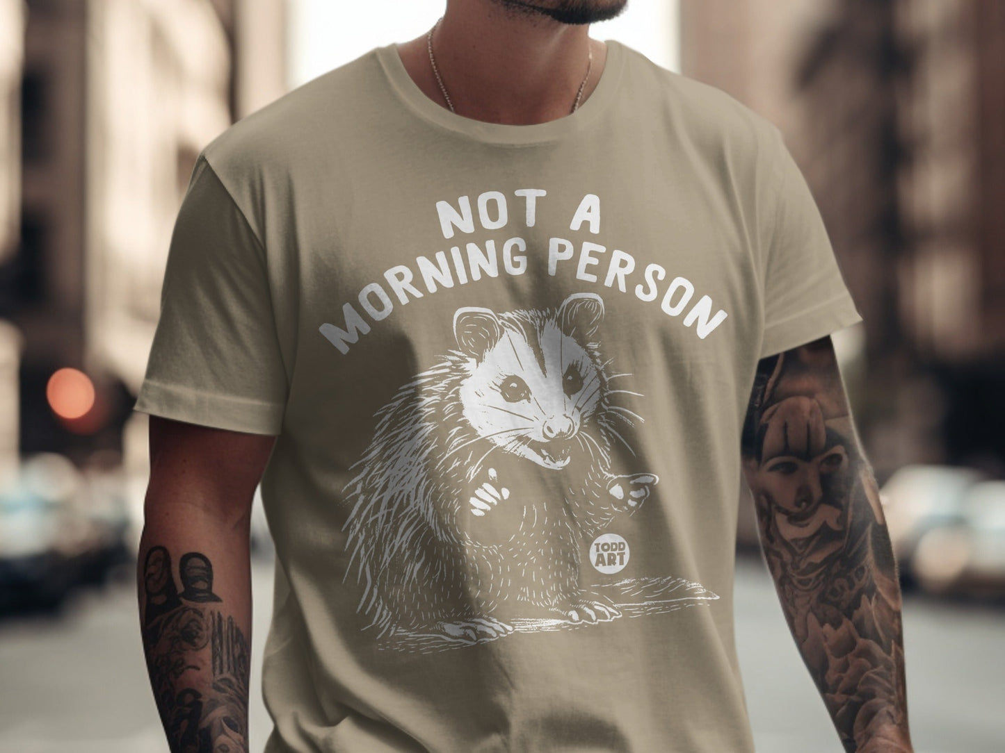 T-shirt with "Not a Morning Person" and a possum illustration.