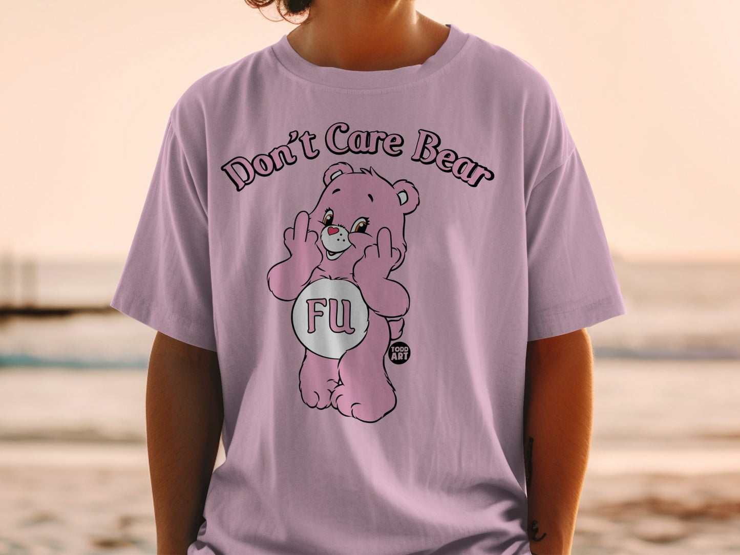 Pink Care Bear shirt with "FU" text and middle fingers raised.