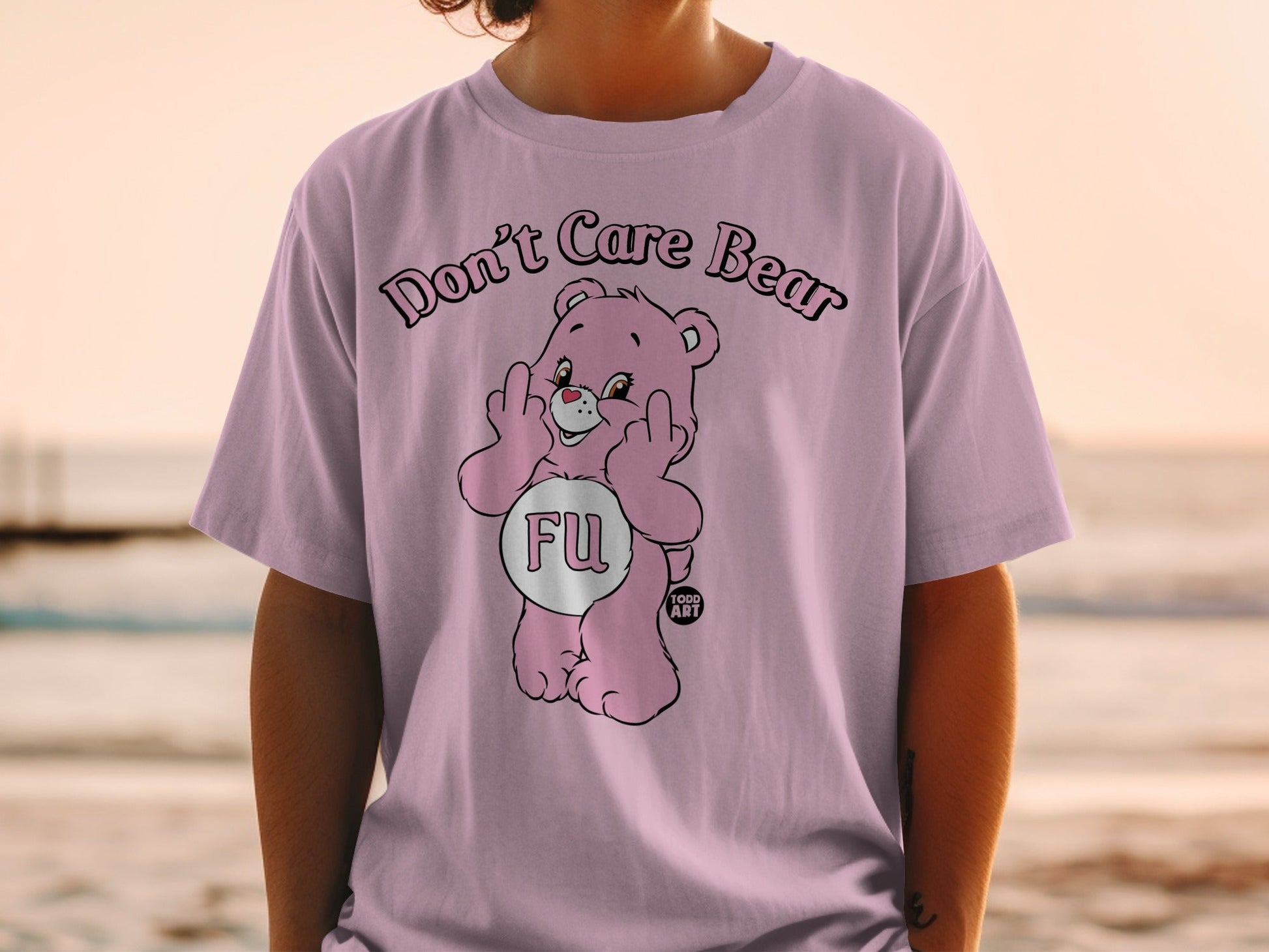 Pink Care Bear shirt with "FU" text and middle fingers raised.