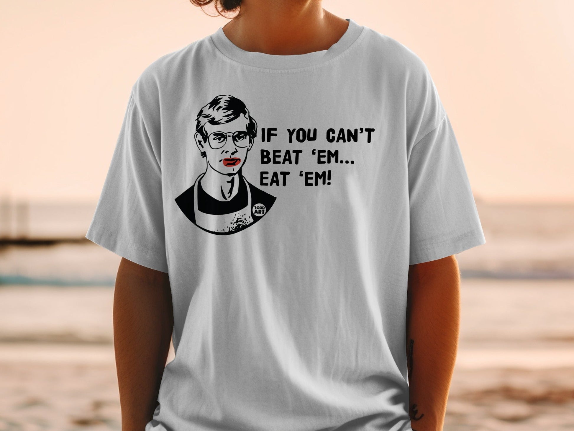 T-shirt with Ruth Bader Ginsburg portrait and "IF YOU CAN'T BEAT 'EM... EAT 'EM!" text.