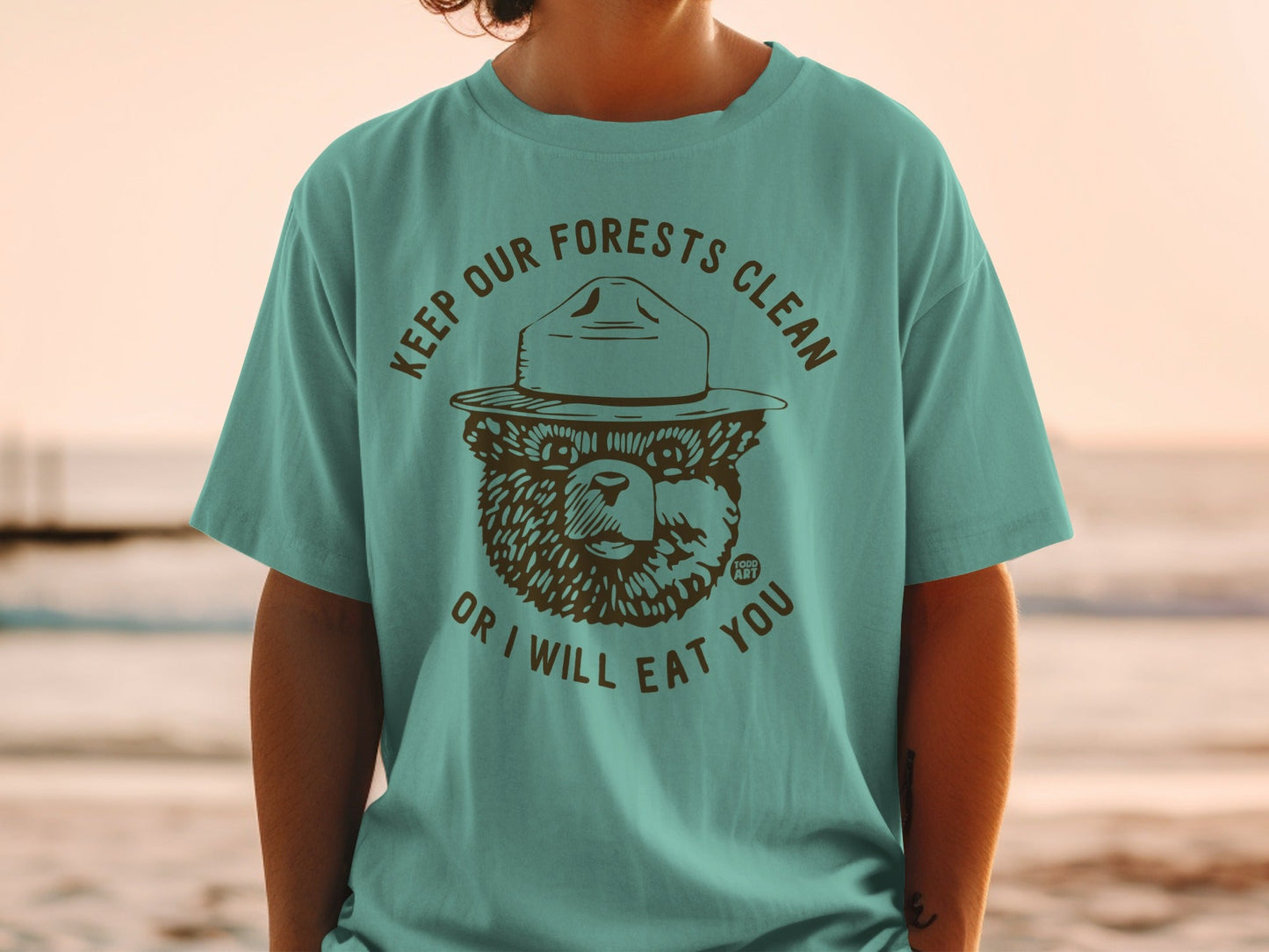 T-shirt with Smokey Bear graphic and "Keep Our Forests Clean or I Will Eat You" text.