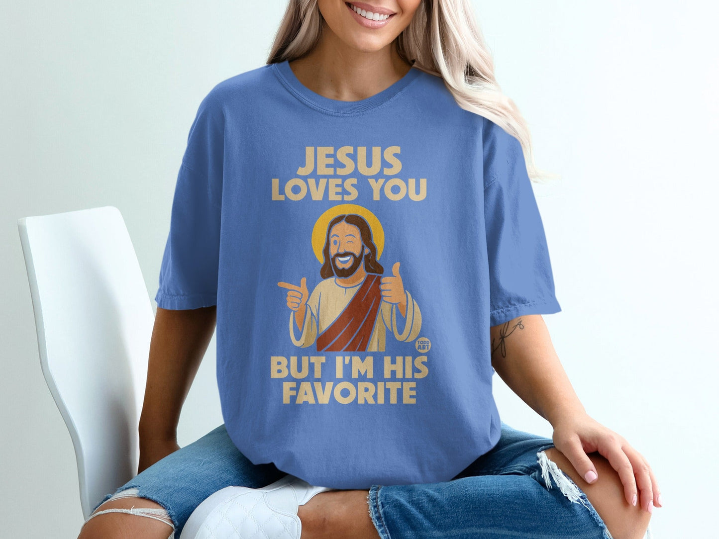 Jesus loves you, but I'm his favorite text on a blue t-shirt.