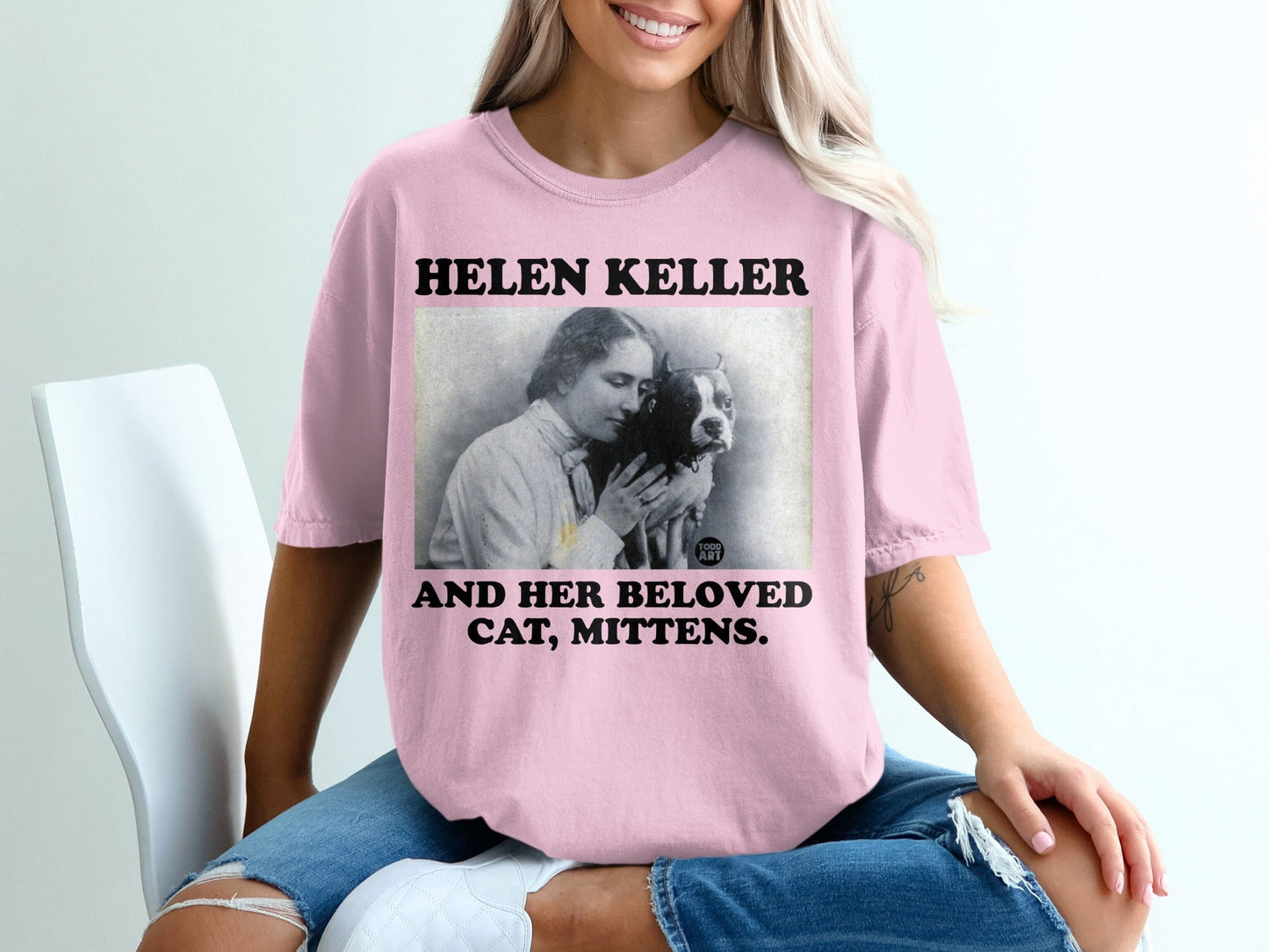T-shirt with vintage photo of Helen Keller and her cat, Mittens.