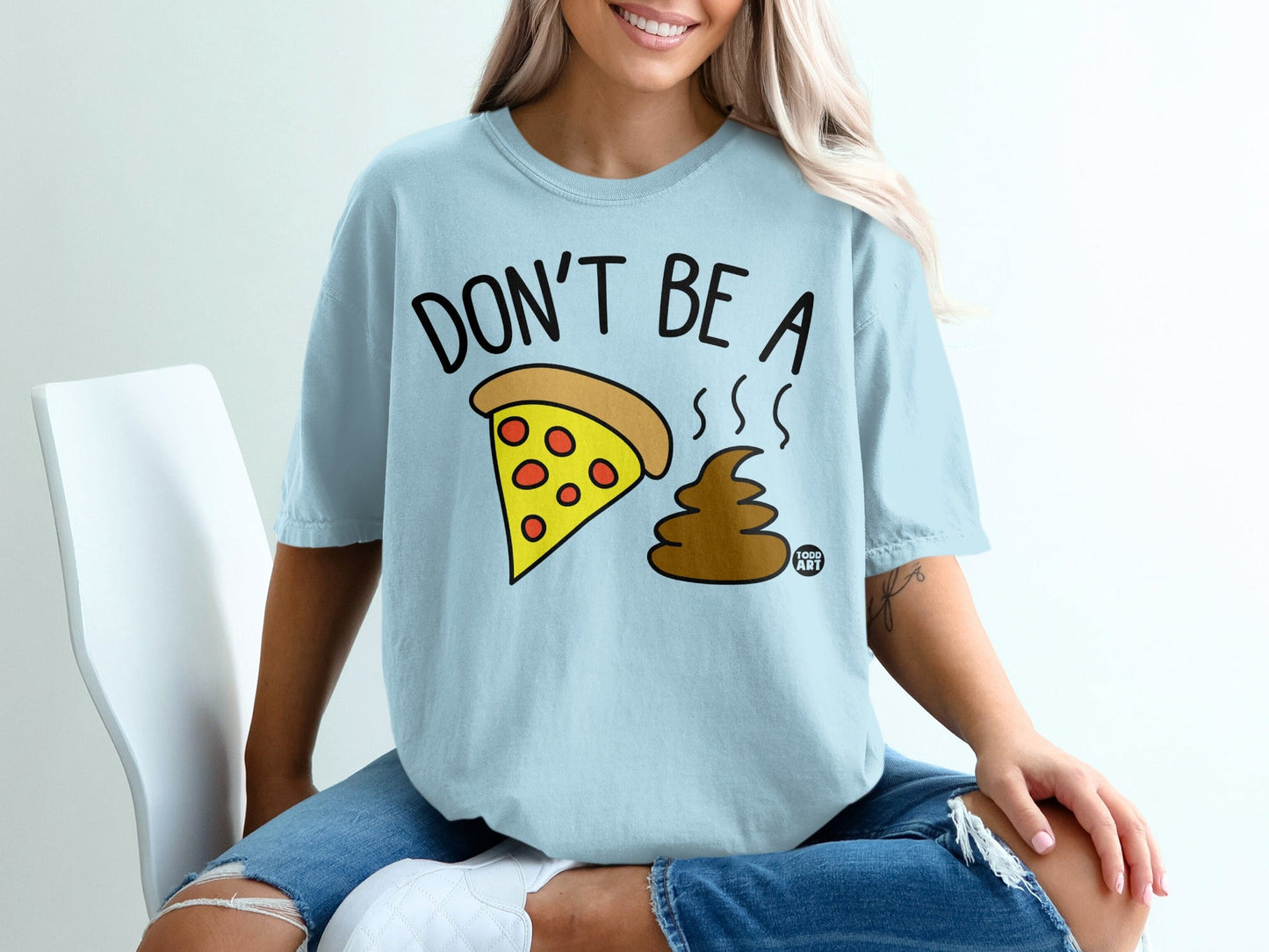 Light blue t-shirt with "DON'T BE A POOP" pizza and cartoon poop graphic.