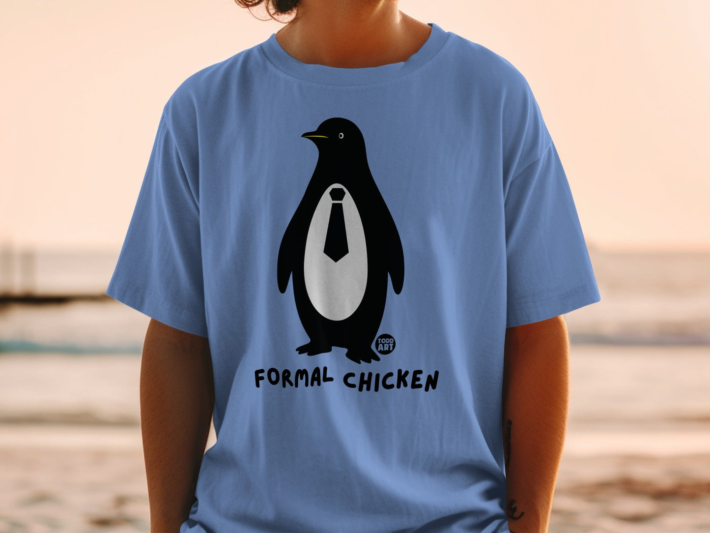 Blue t-shirt with a black penguin wearing a white tie and the text "FORMAL CHICKEN".
