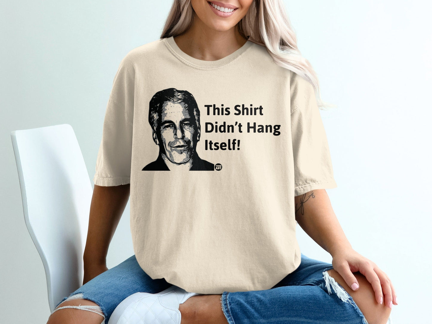 T-shirt with a portrait of a man and text "This Shirt Didn't Hang Itself!"
