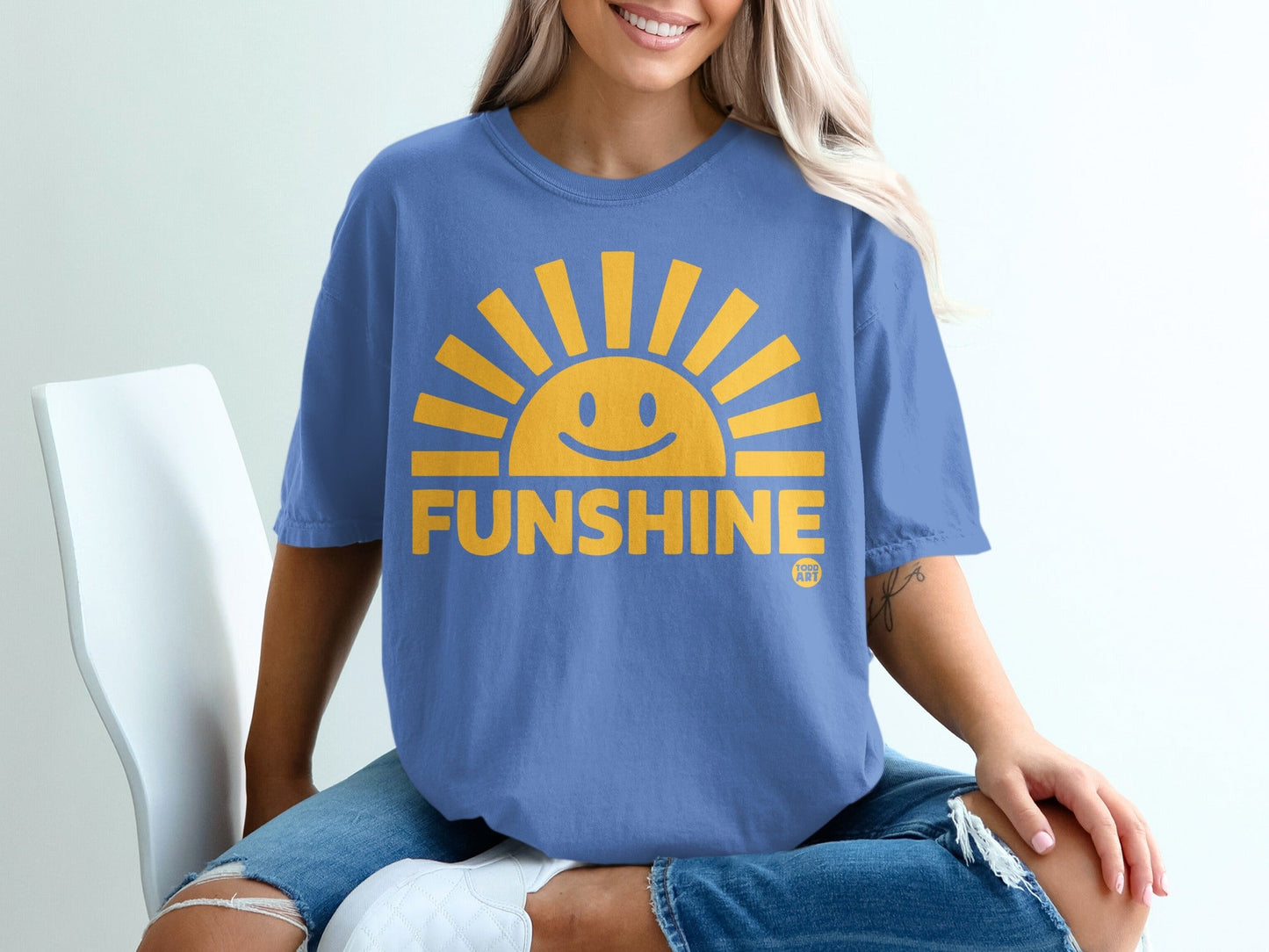 Blue t-shirt with yellow smiley sun graphic and "FUNSHINE" text.