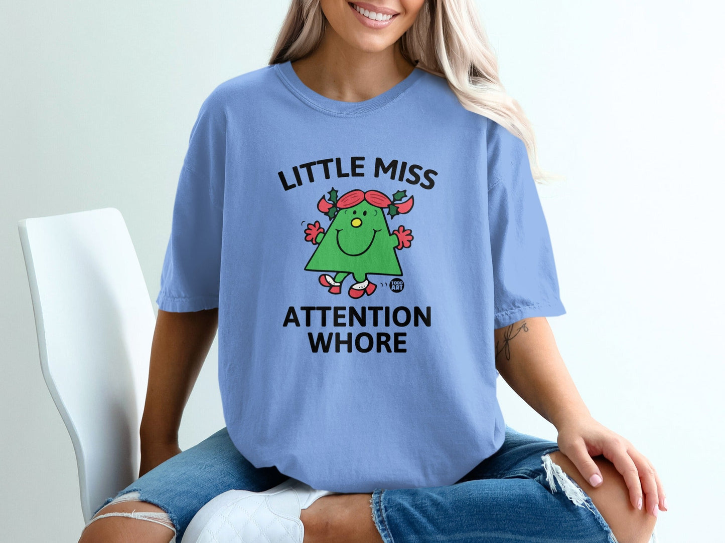 Light blue t-shirt with green cartoon character and "Little Miss Attention Whore" text.