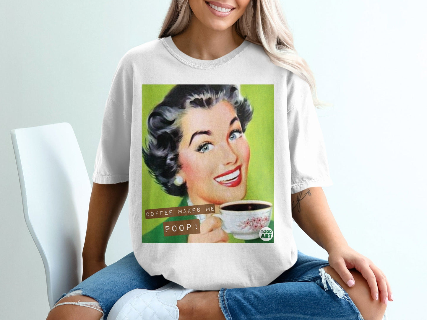 Woman in white t-shirt holding coffee cup with text "COFFEE MAKES ME POOP!"