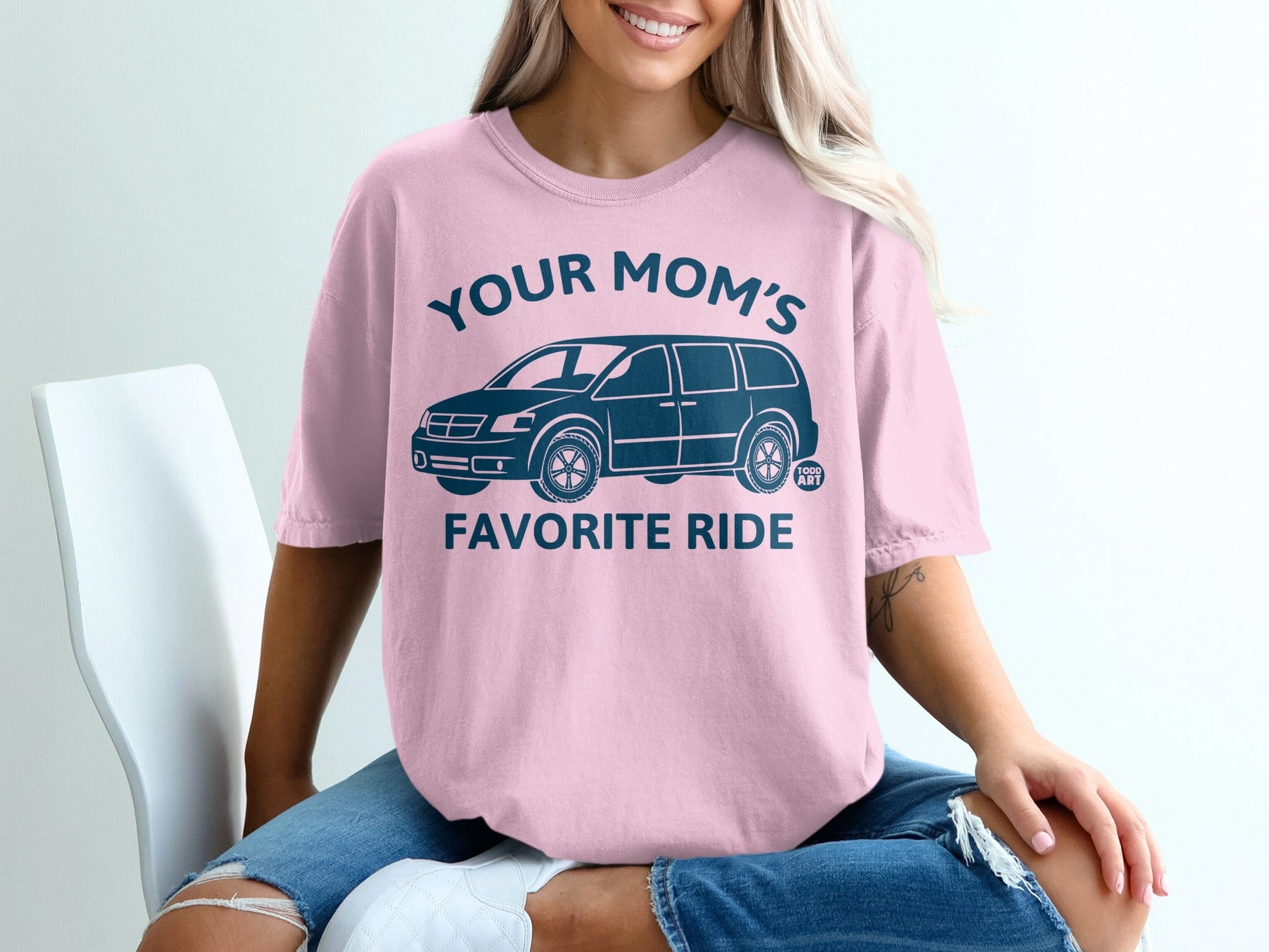 Pink t-shirt with "Your Mom's Favorite Ride" and a blue minivan graphic.