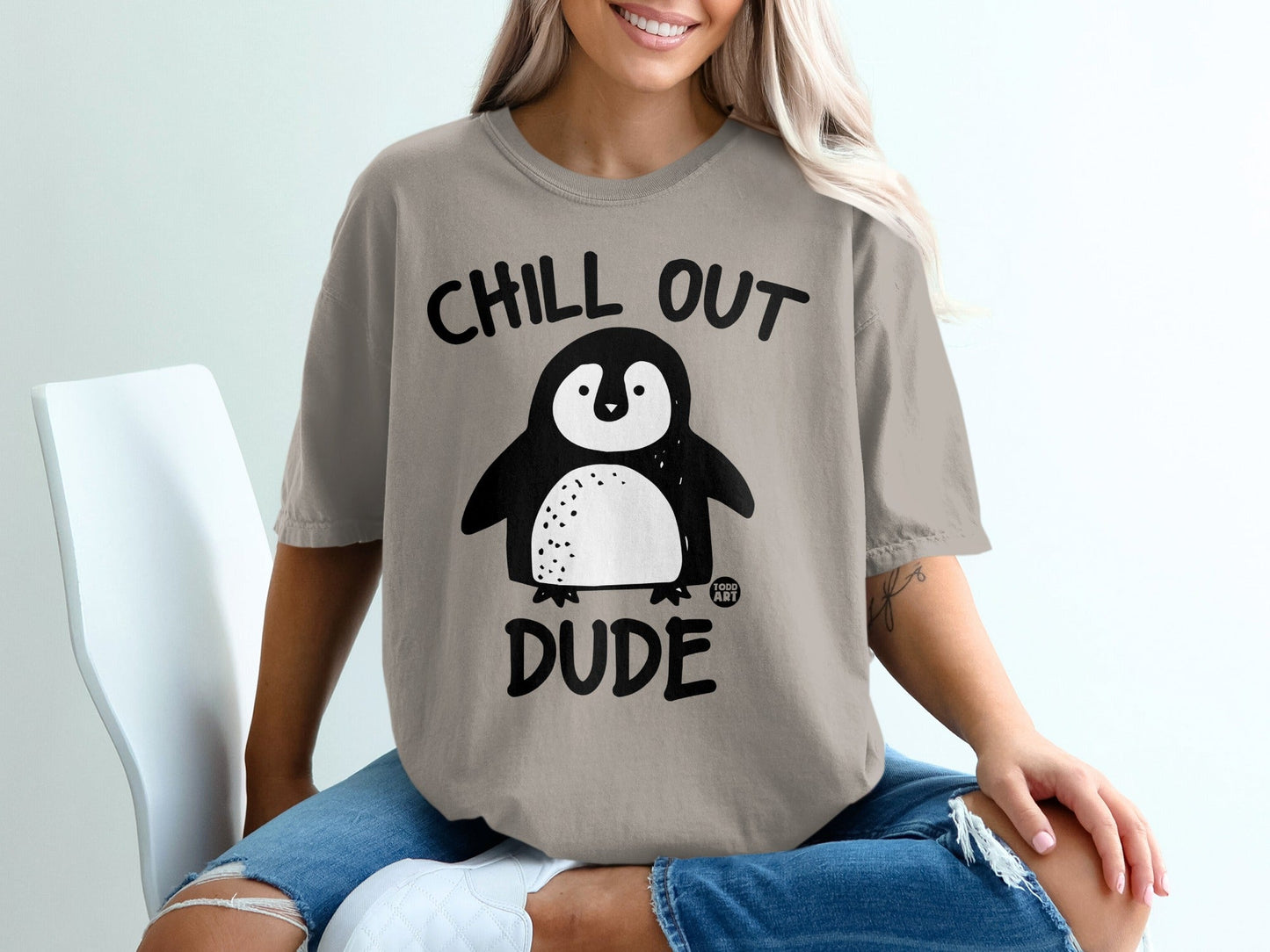 T-shirt with "Chill Out Dude" text and a cartoon penguin.