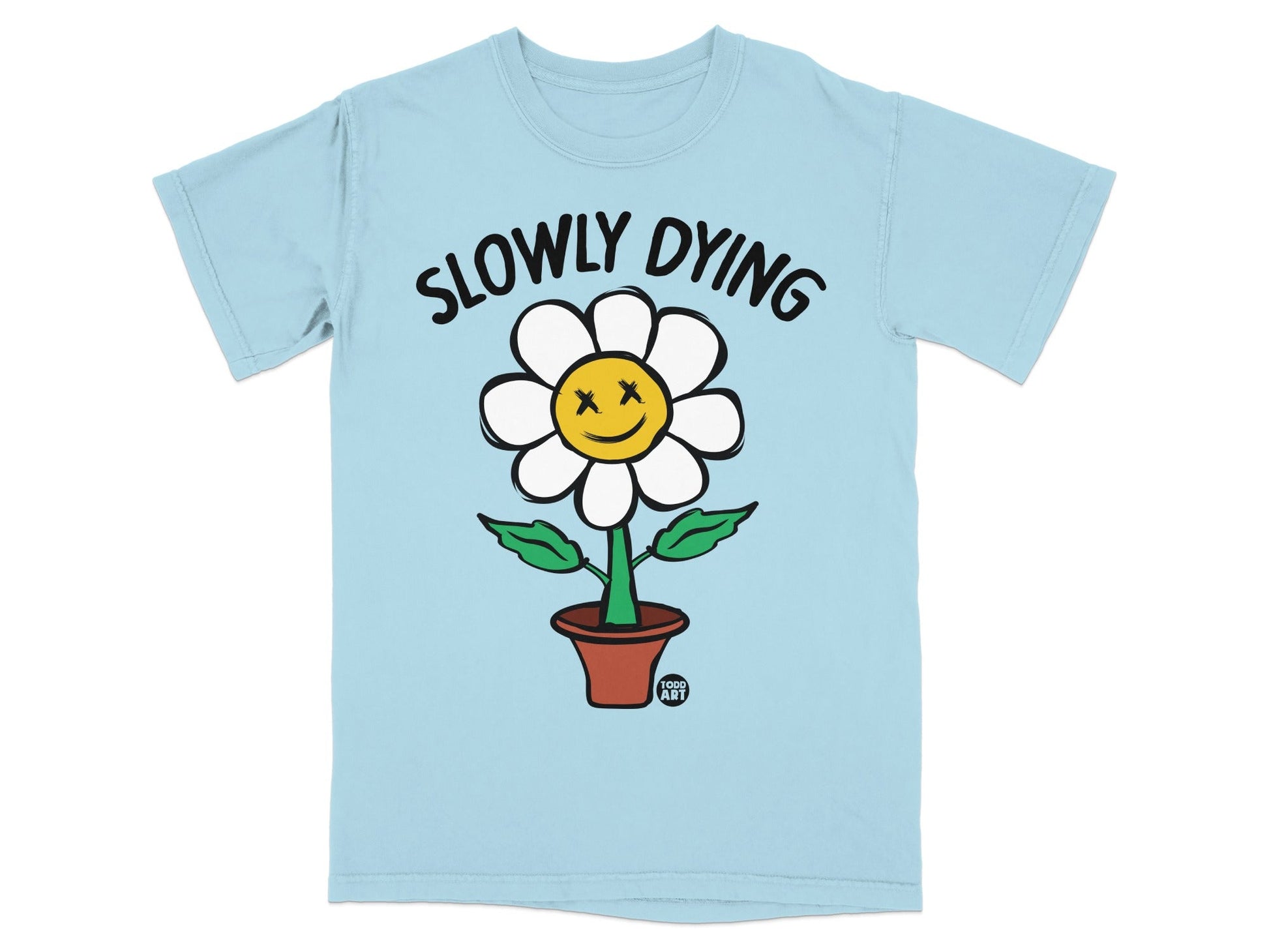 Light blue t-shirt with a cartoon flower with x's for eyes and the text "SLOWLY DYING".
