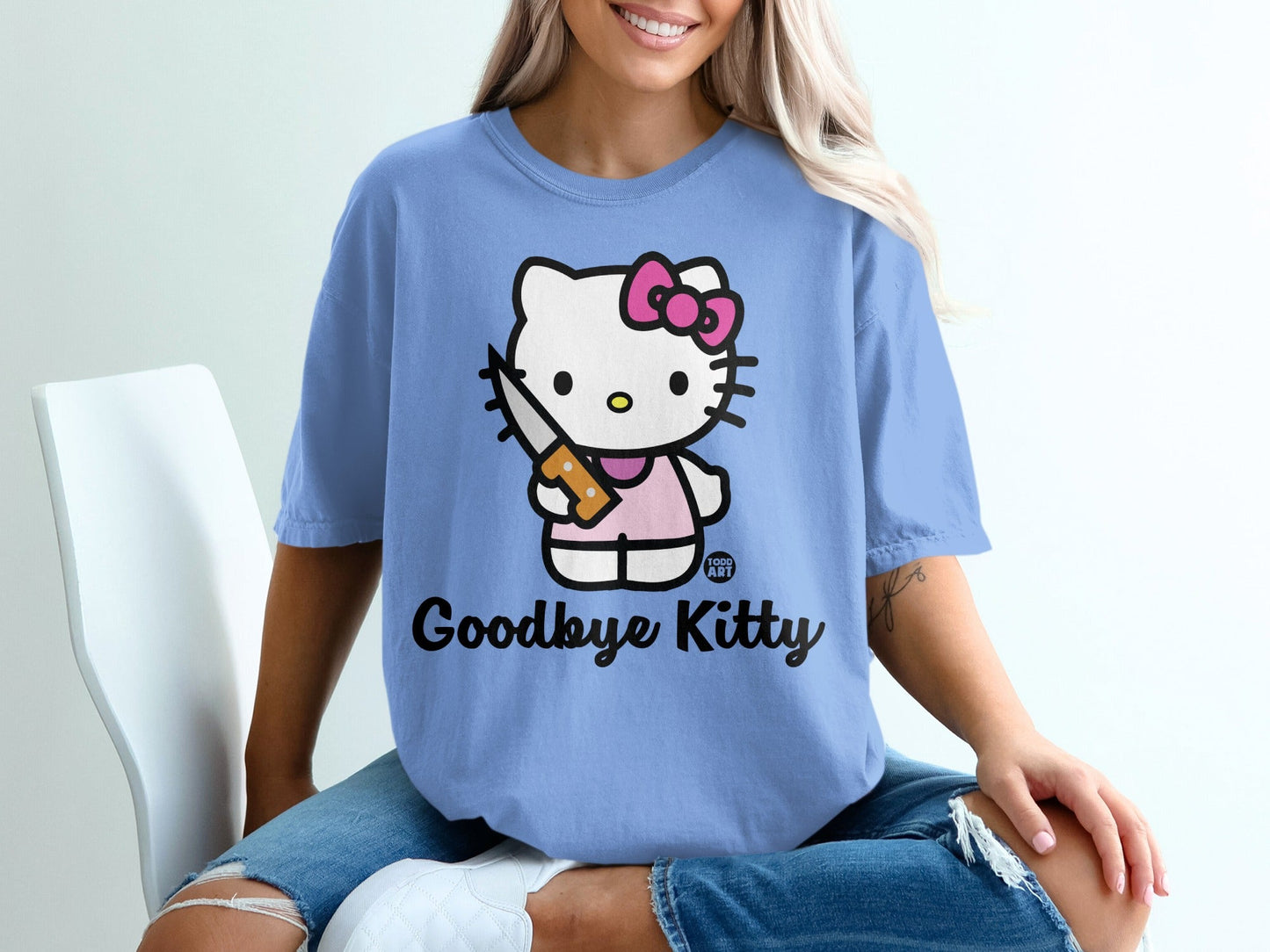 Blue t-shirt with Hello Kitty holding a knife, "Goodbye Kitty" text.