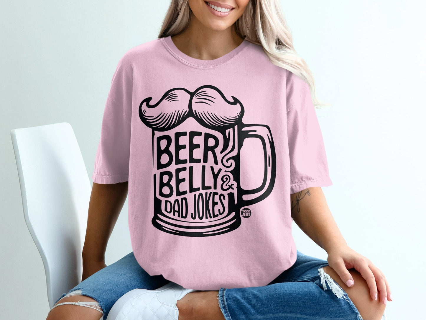 Pink t-shirt with "Beer Belly & Dad Jokes" graphic featuring a beer mug and mustache.