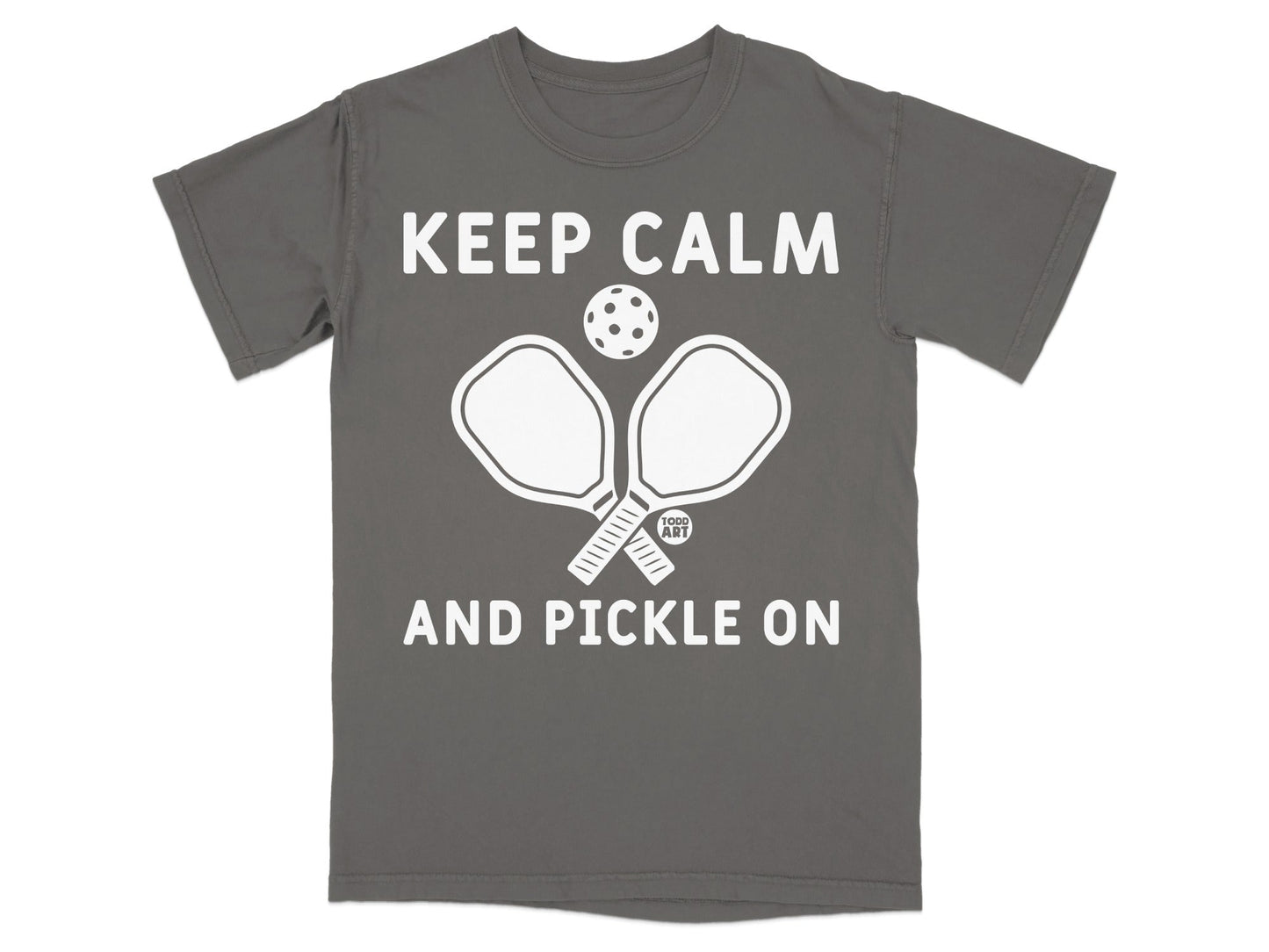 Gray t-shirt with "KEEP CALM AND PICKLE ON" text and pickleball paddles.