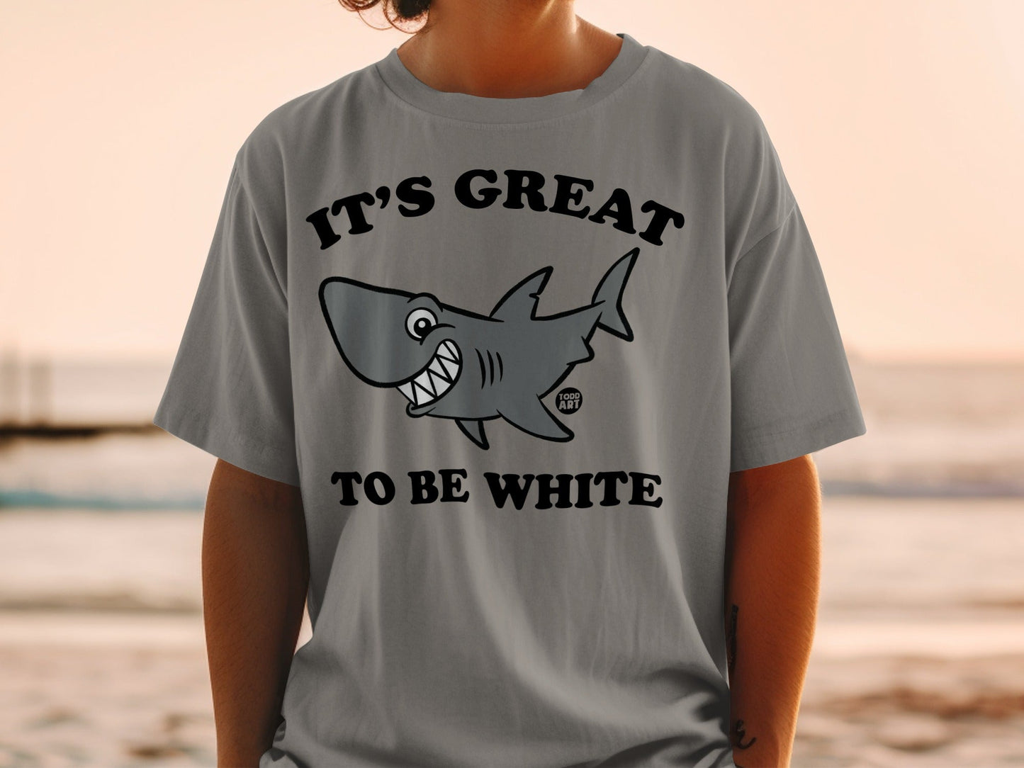 T-shirt with smiling cartoon shark and text "IT'S GREAT TO BE WHITE".