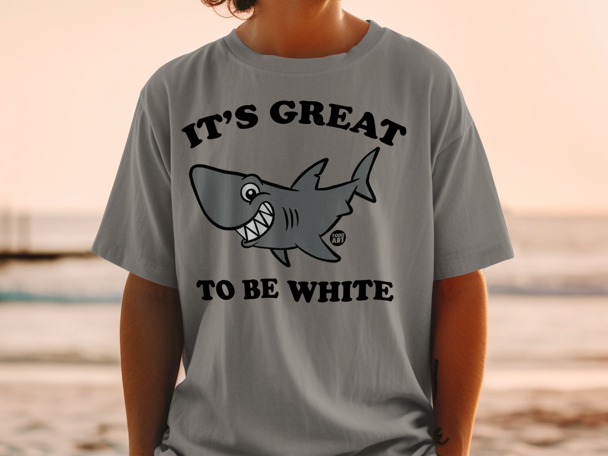 T-shirt with smiling cartoon shark and text "IT'S GREAT TO BE WHITE".
