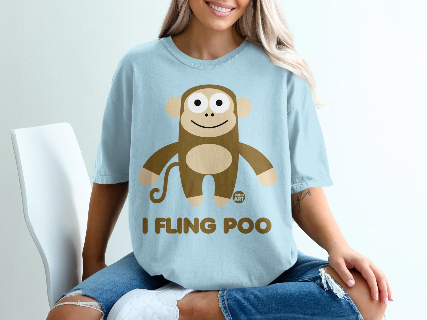 Light blue t-shirt with cartoon monkey and text "I FLING POO".
