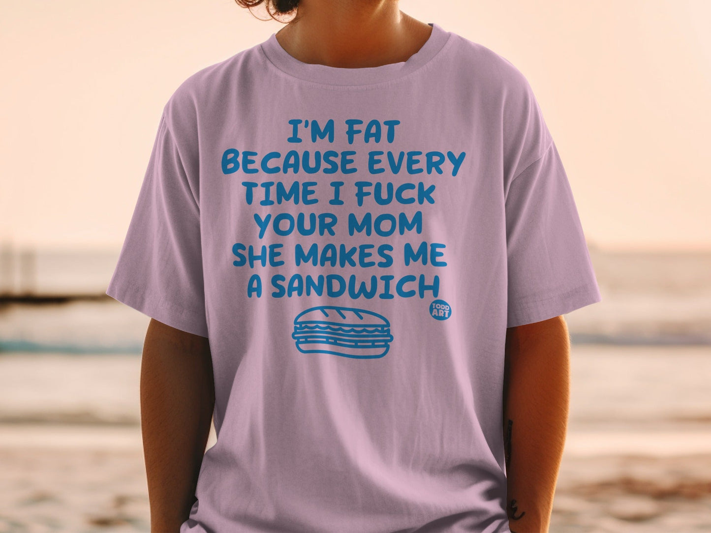 Lilac t-shirt with a sandwich graphic and humorous text.
