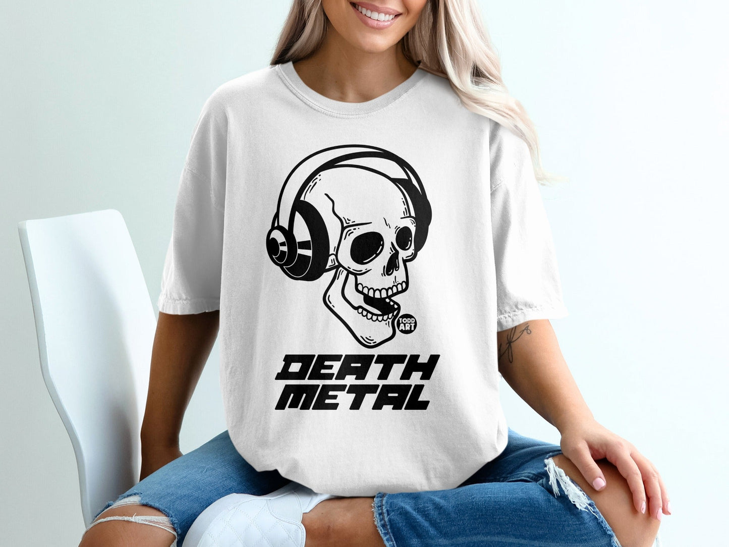 White t-shirt with skull wearing headphones, "DEATH METAL" text.
