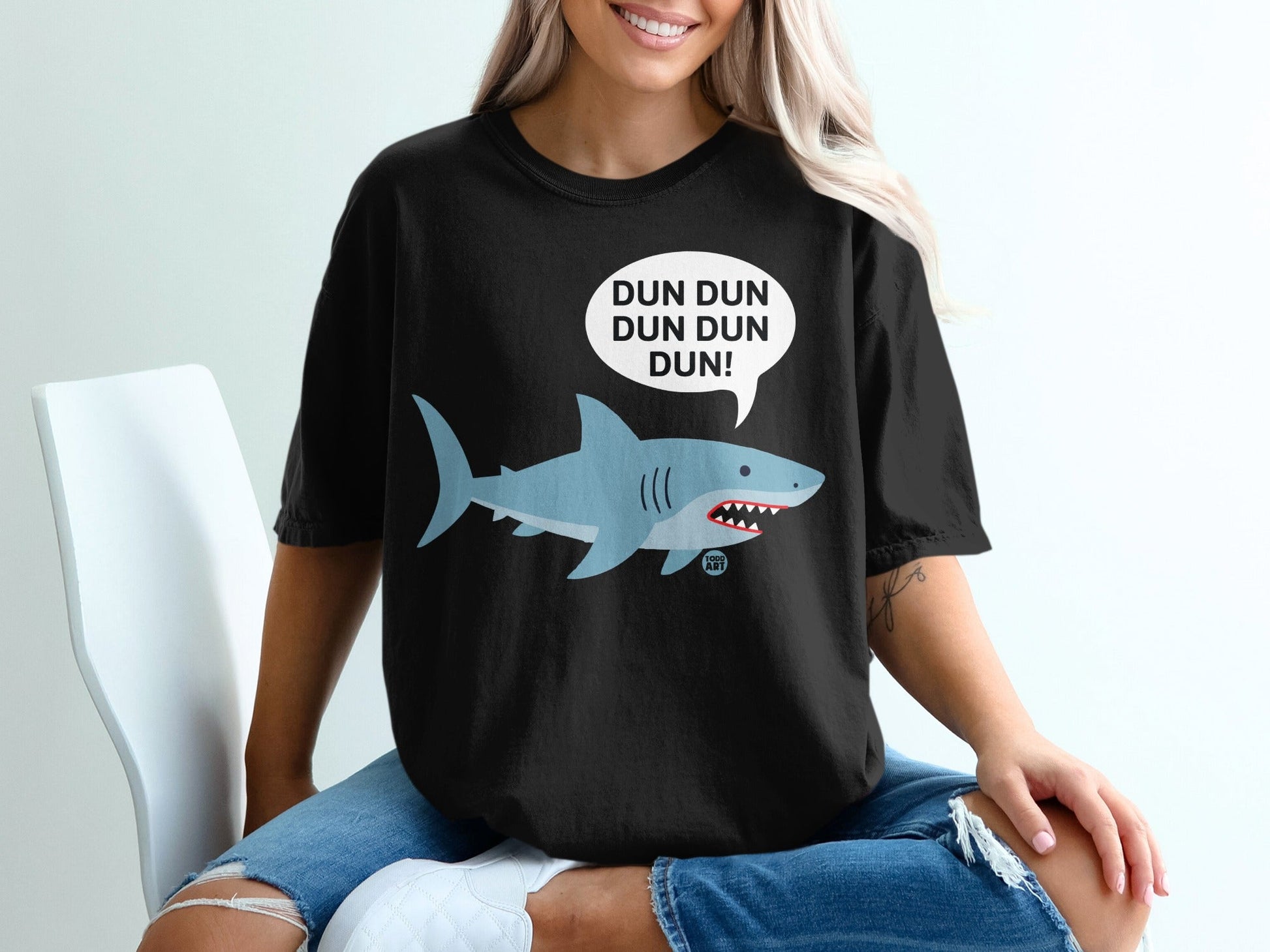 Black t-shirt with a cartoon shark and "DUN DUN DUN DUN!" speech bubble.