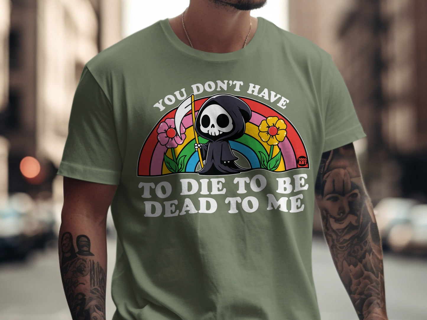 T-shirt with grim reaper, flowers, and rainbow with text "You don't have to die to be dead to me."