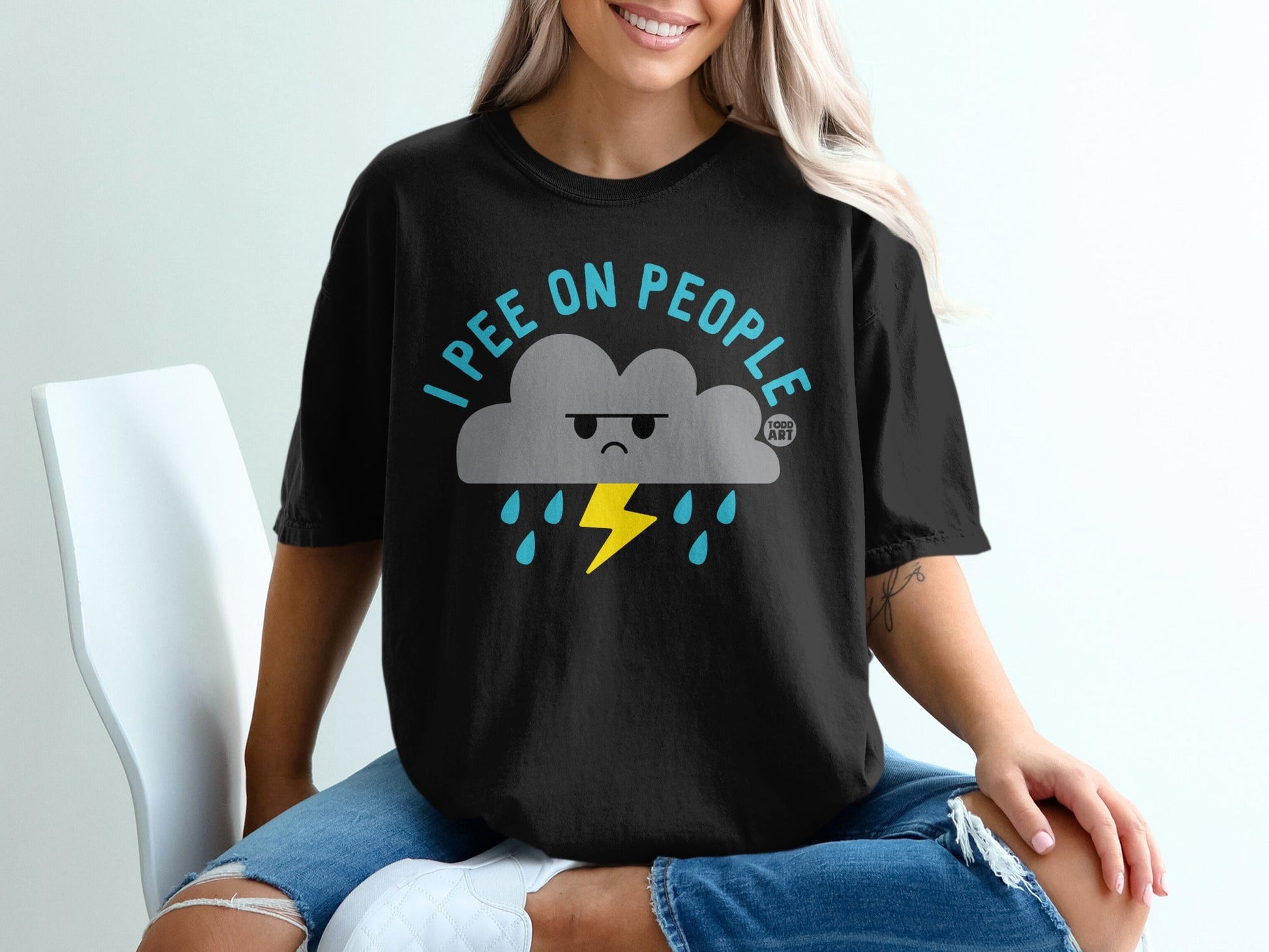 Black t-shirt with a grumpy cloud, lightning, and rain graphic, text "I pee on people".