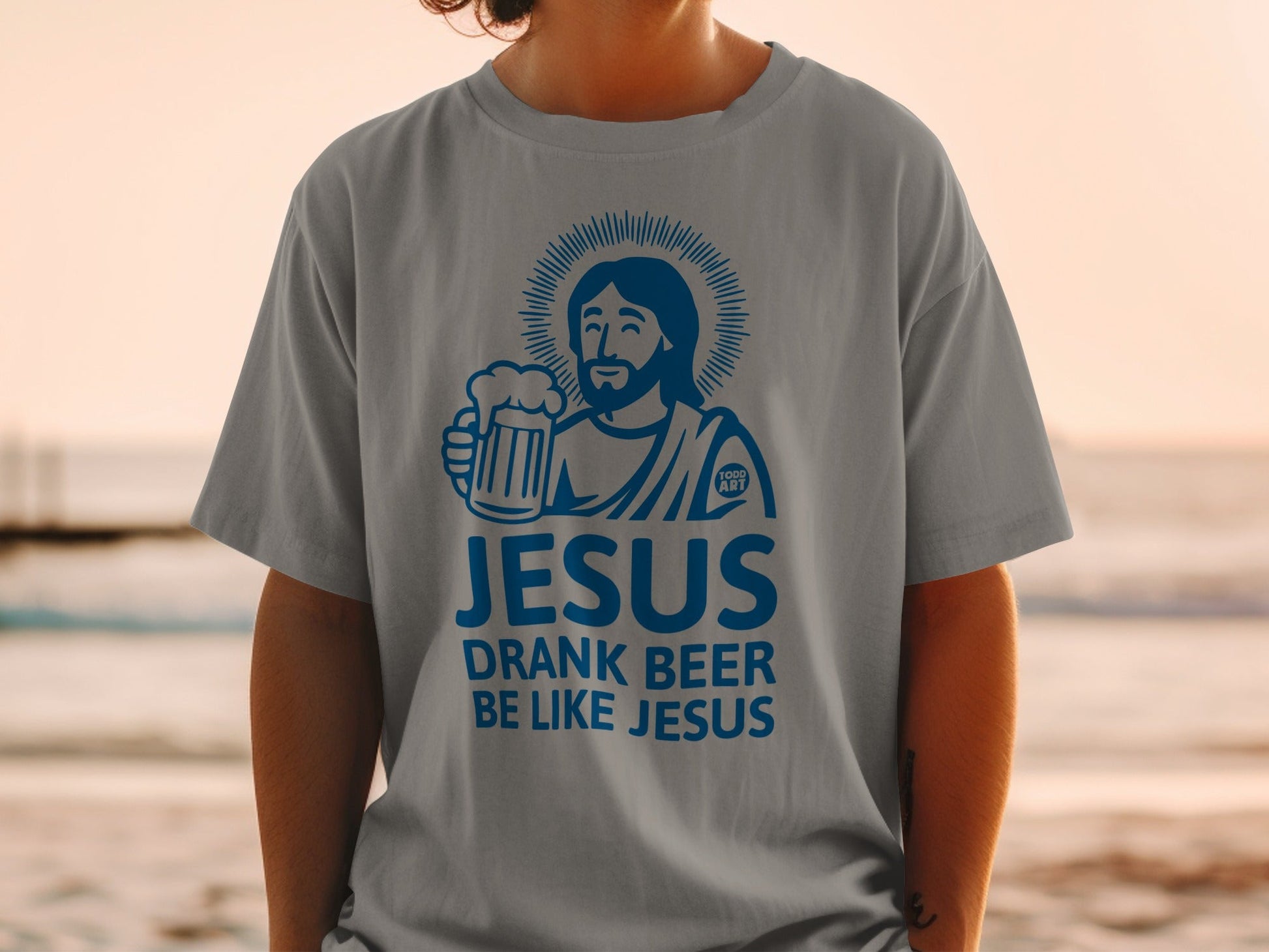 Jesus holding a beer mug with "JESUS DRANK BEER LIKE JESUS" text.