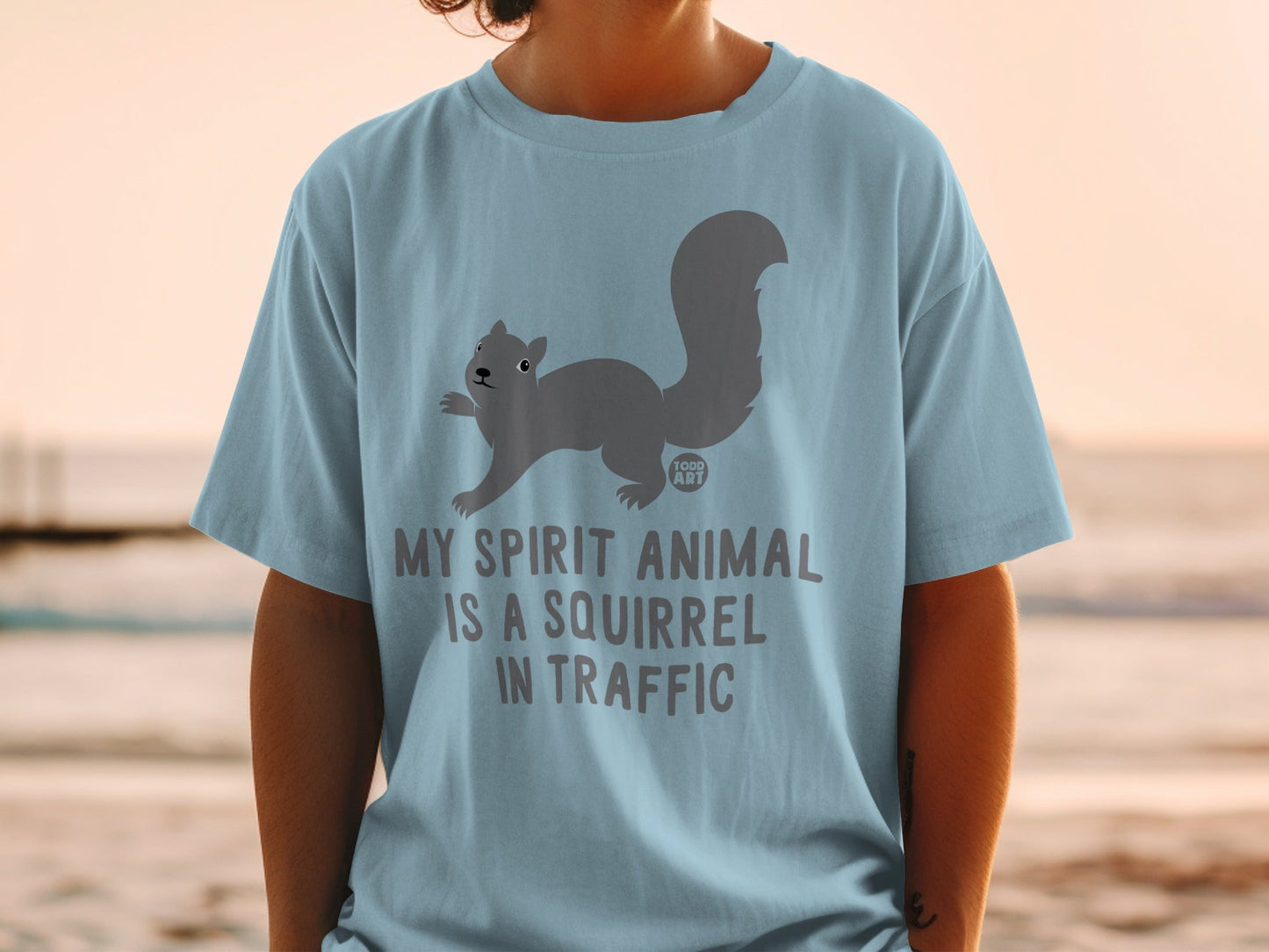 Light blue t-shirt with "My spirit animal is a squirrel in traffic" and squirrel graphic.