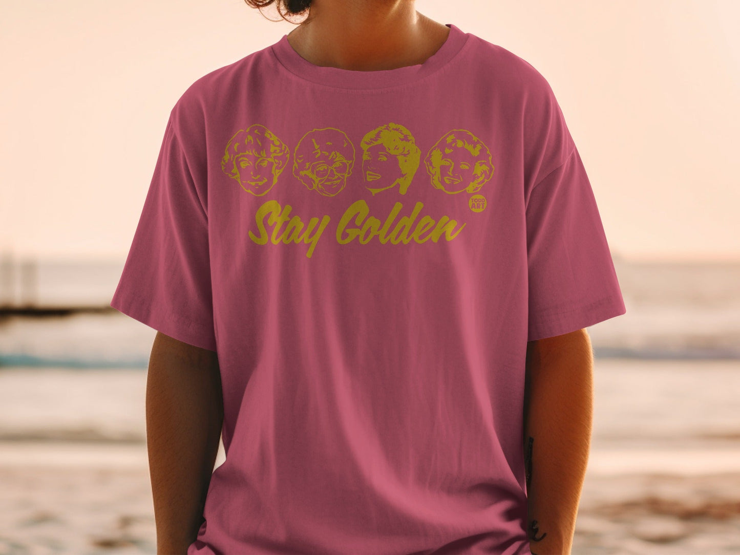 T-shirt with The Golden Girls cast portraits and "Stay Golden" text.