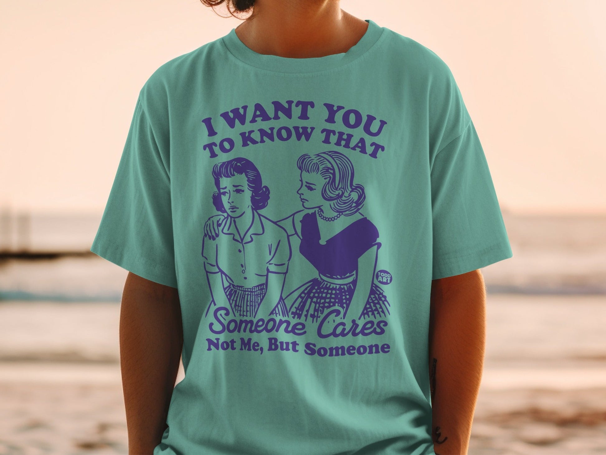 T-shirt with vintage cartoon illustration and text about caring.