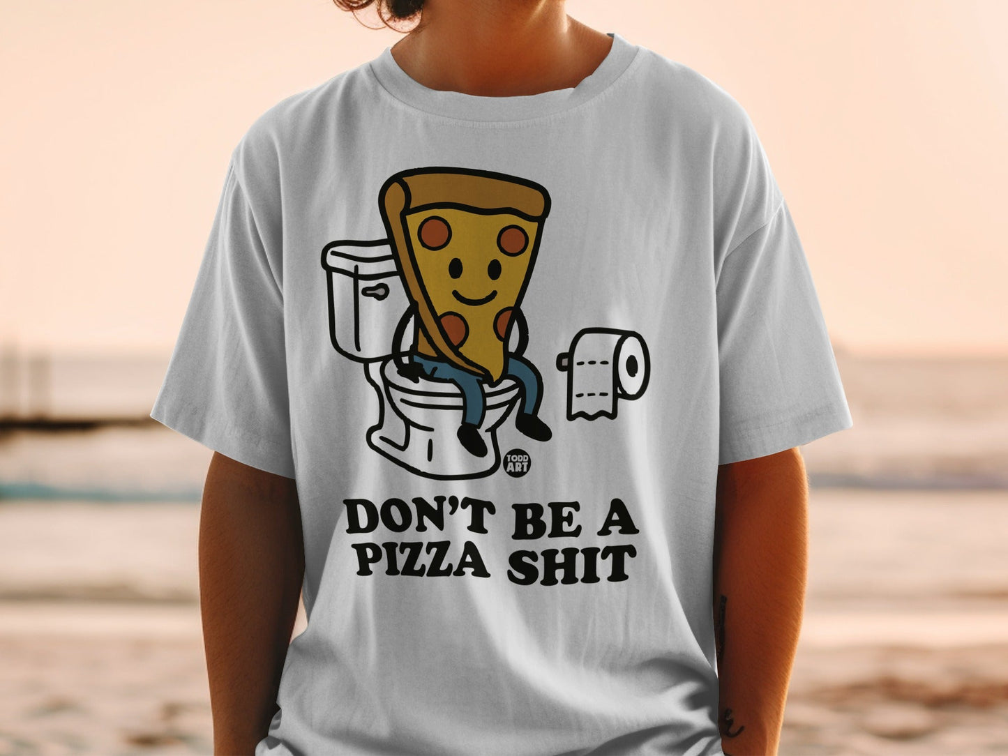 T-shirt with cartoon pizza slice on toilet, "DON'T BE A PIZZA SHIT" text.
