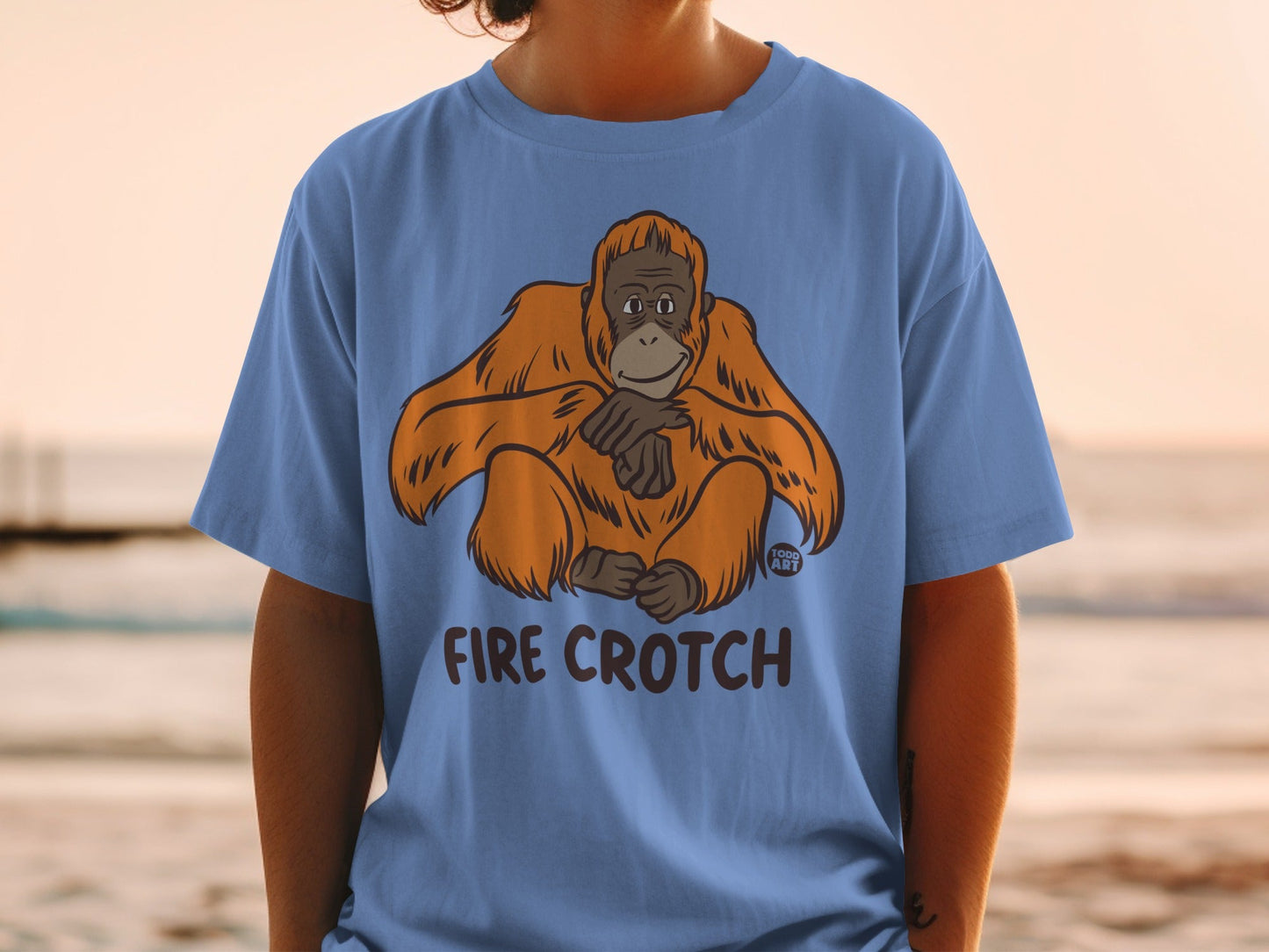 Blue t-shirt with orange orangutan illustration and "FIRE CROTCH" text.