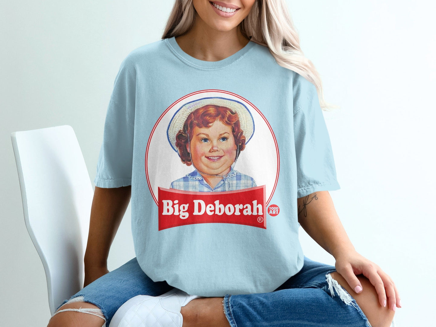 Light blue t-shirt with "Big Deborah" vintage food label graphic.
