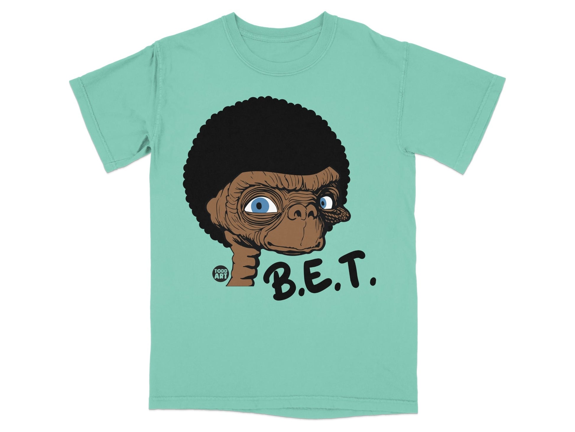 E.T. cartoon character on a teal t-shirt with "B.E.T." text.