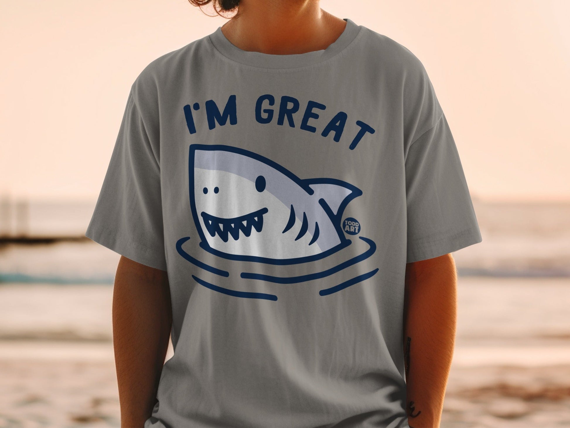 Grey t-shirt with a cartoon shark and "I'M GREAT" text.
