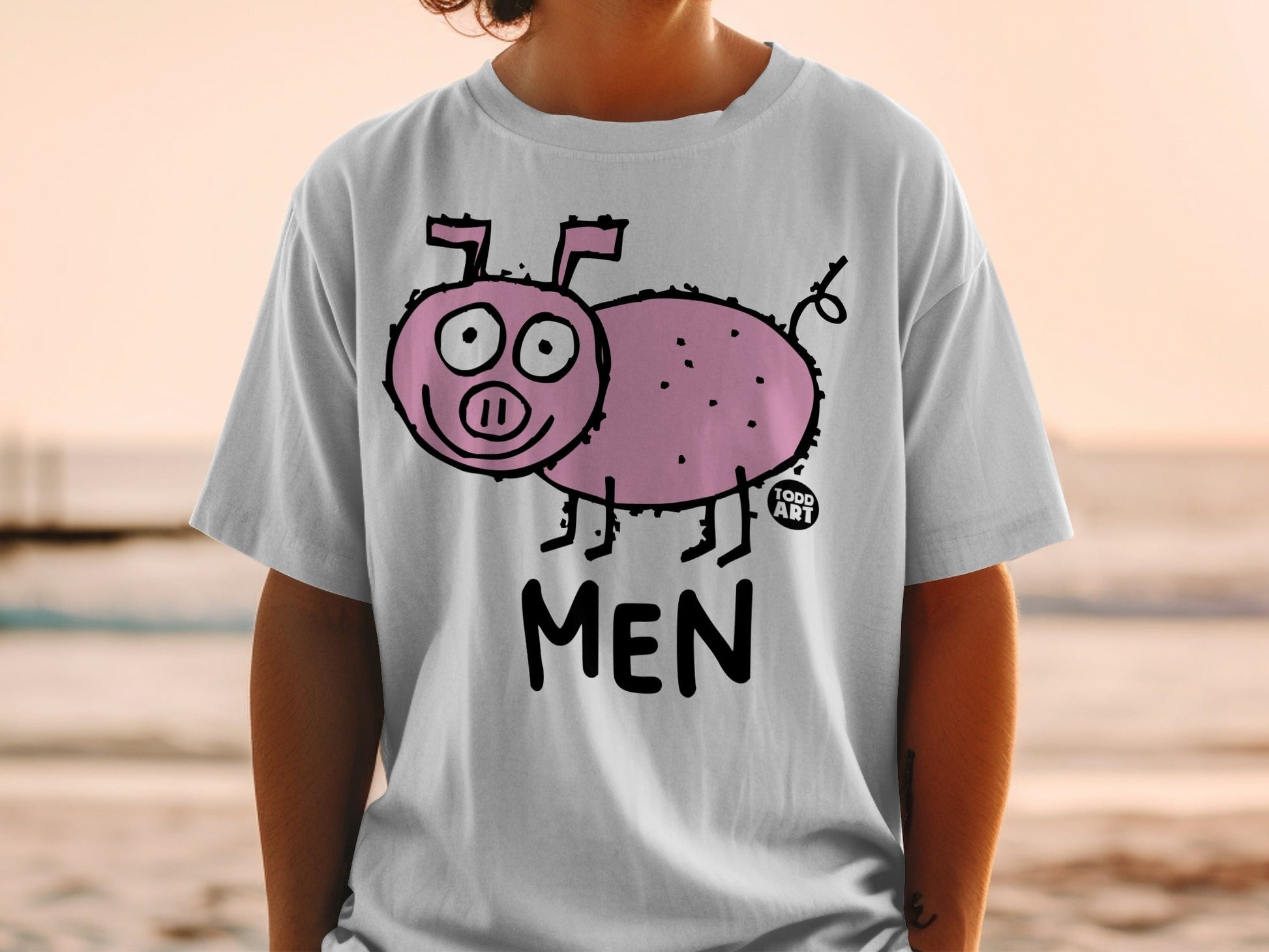White t-shirt with a cartoon pig and "MEN" text printed on it.