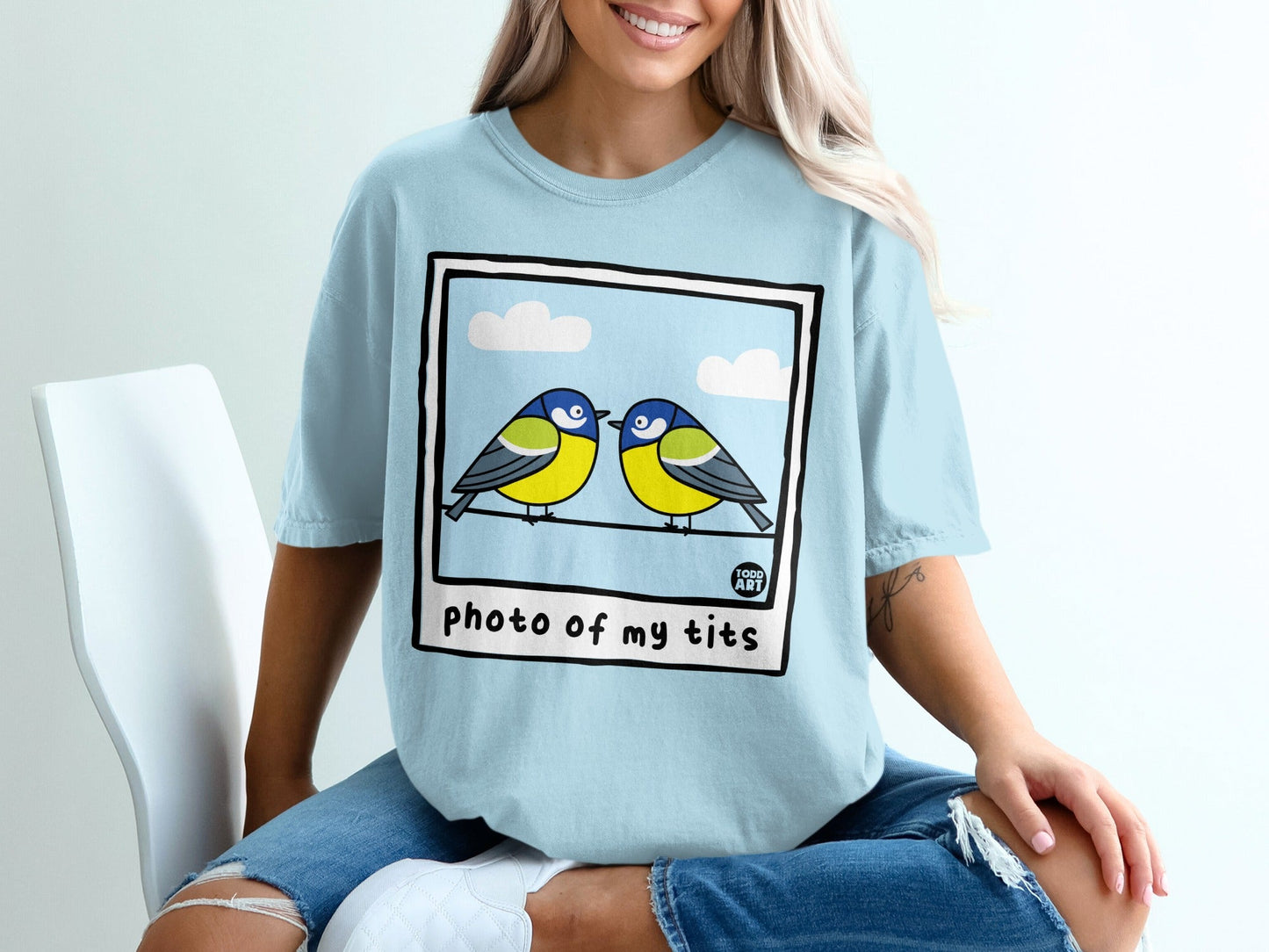 Two blue tits perched on a wire, text "photo of my tits"