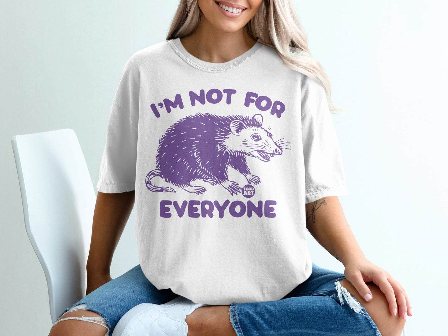White t-shirt with purple opossum graphic and text "I'M NOT FOR EVERYONE".
