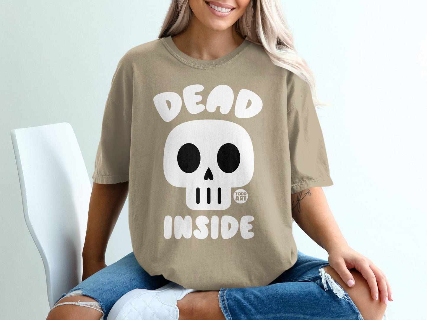 T-shirt with a skull graphic and "DEAD INSIDE" text.