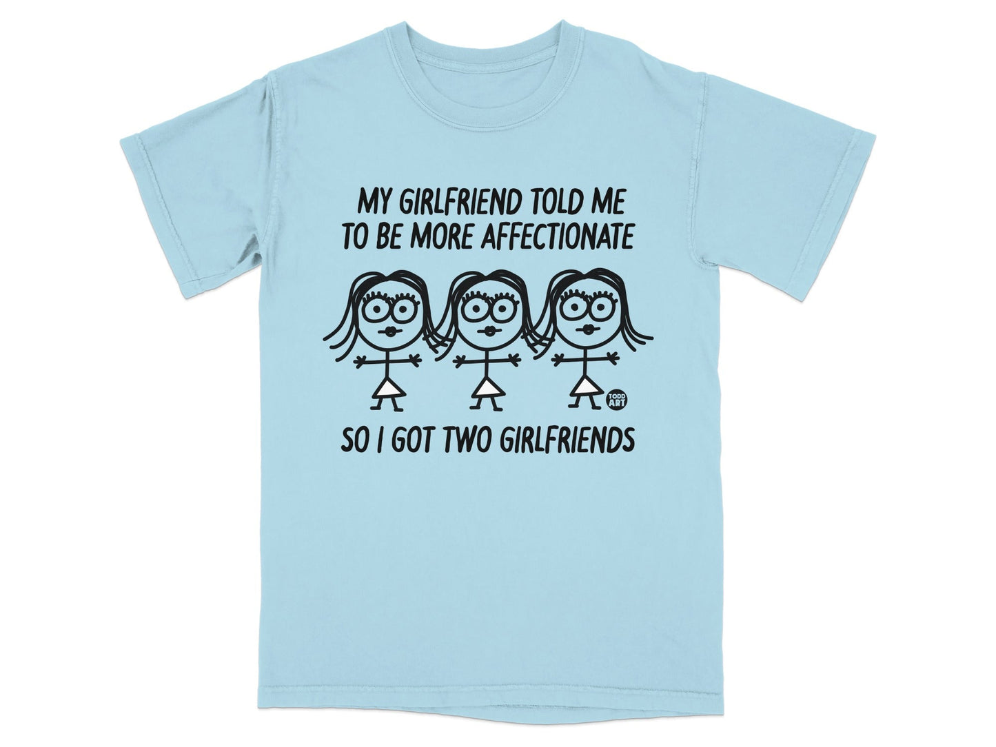 Light blue t-shirt with "MY GIRLFRIEND TOLD ME TO BE MORE AFFECTIONATE SO I GOT TWO GIRLFRIENDS" text and cartoon figures.