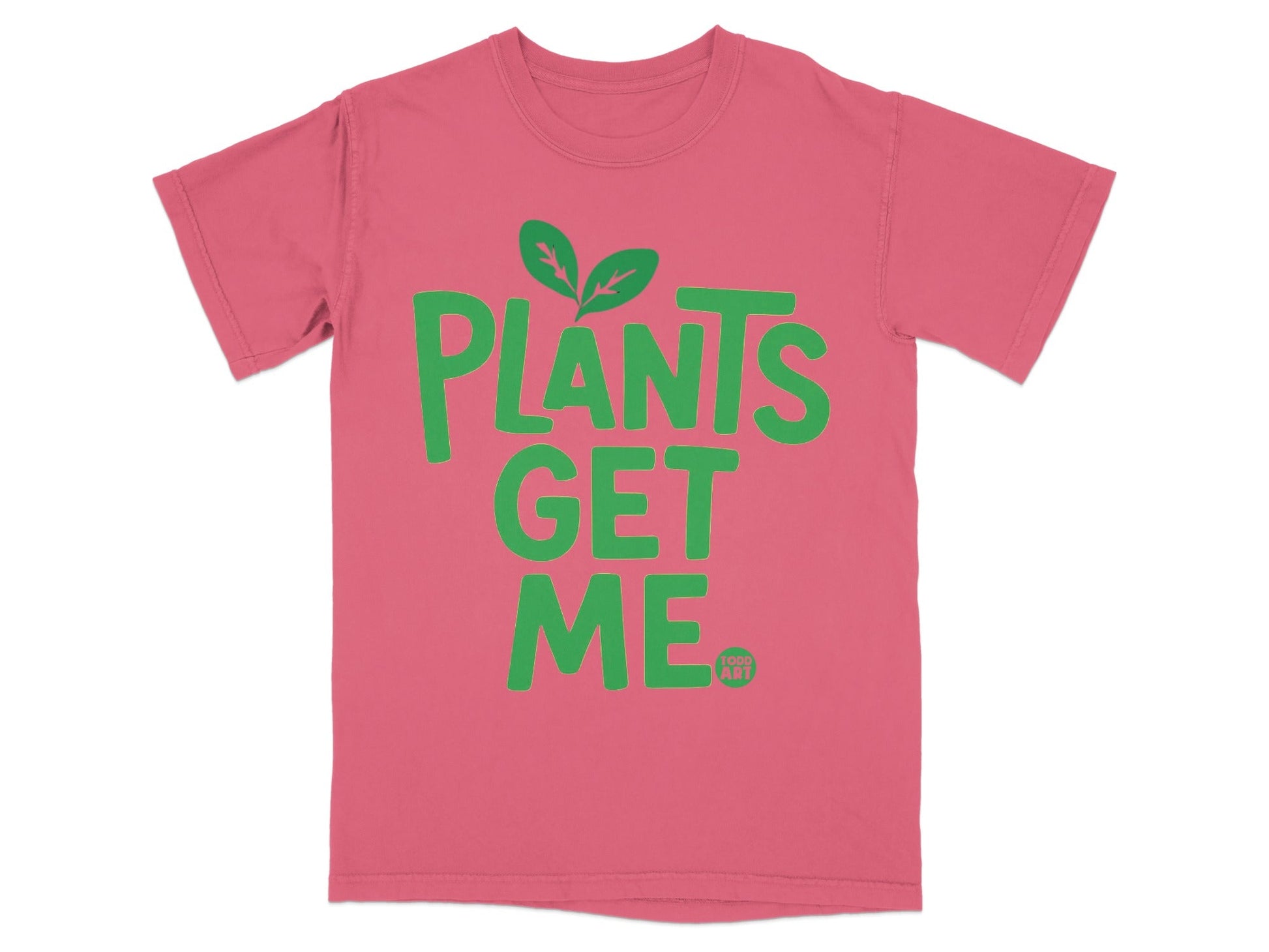 Pink t-shirt with green text "PLANTS GET ME" and small logo.