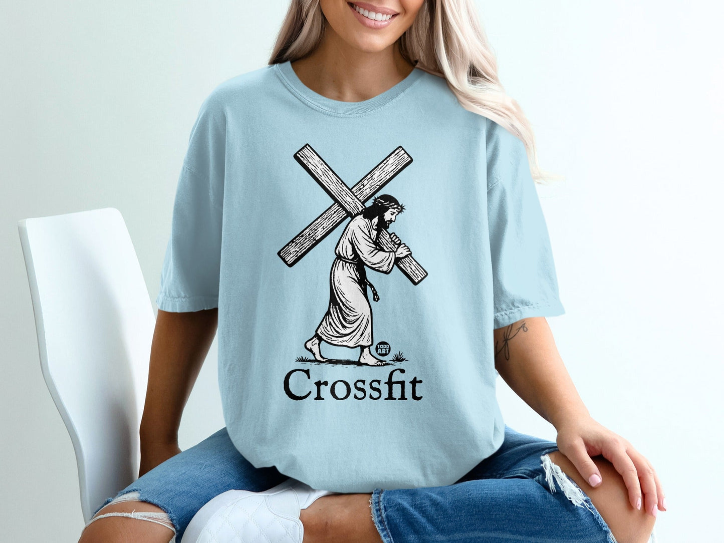Light blue t-shirt featuring Jesus carrying a cross with "Crossfit" text below.