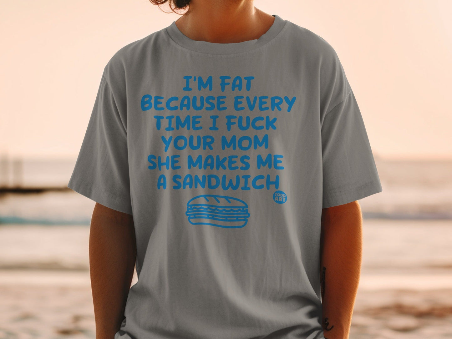 Gray t-shirt with blue text and a sandwich illustration.