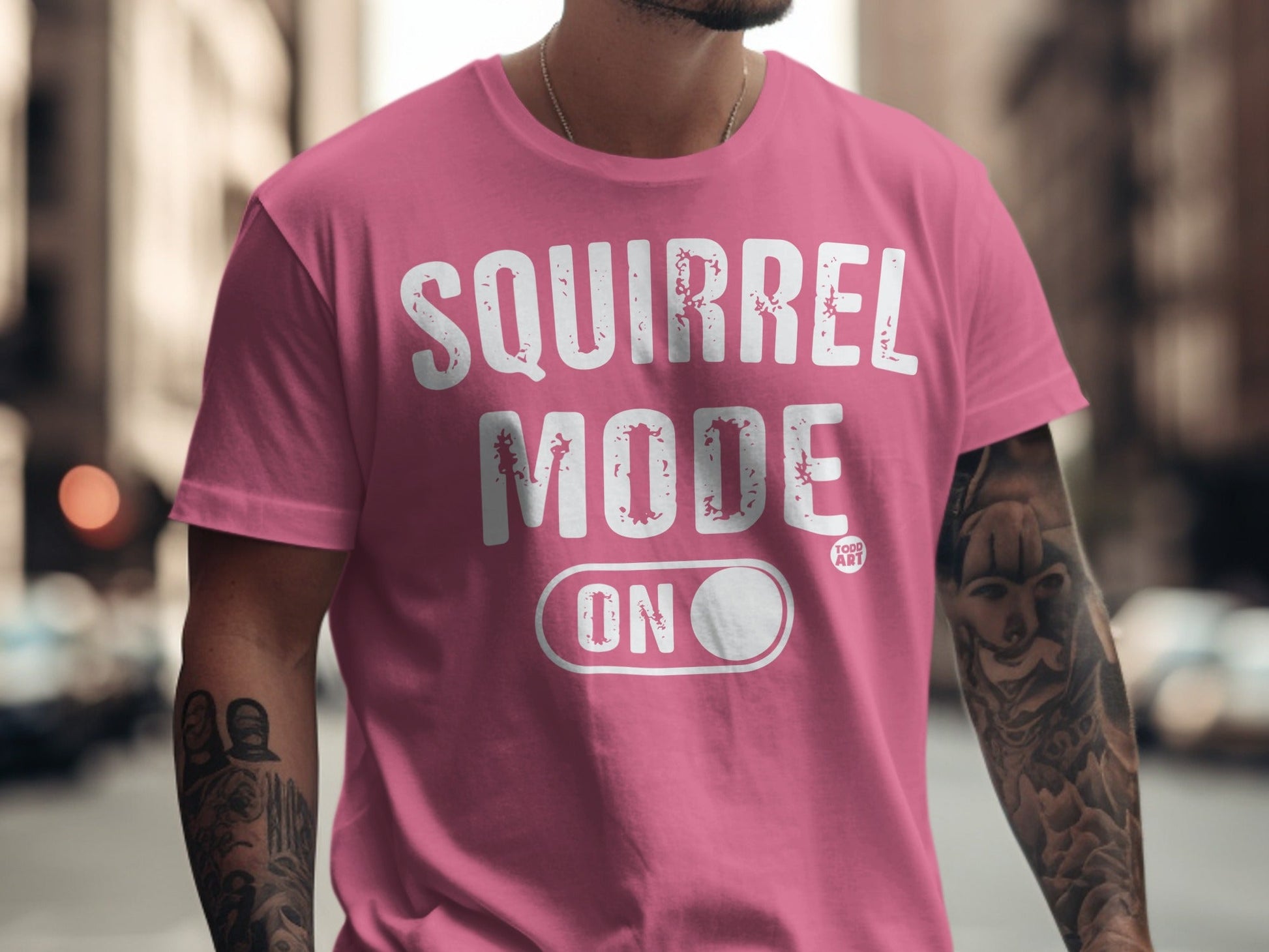 Pink t-shirt with "SQUIRREL MODE ON" text and toggle switch.