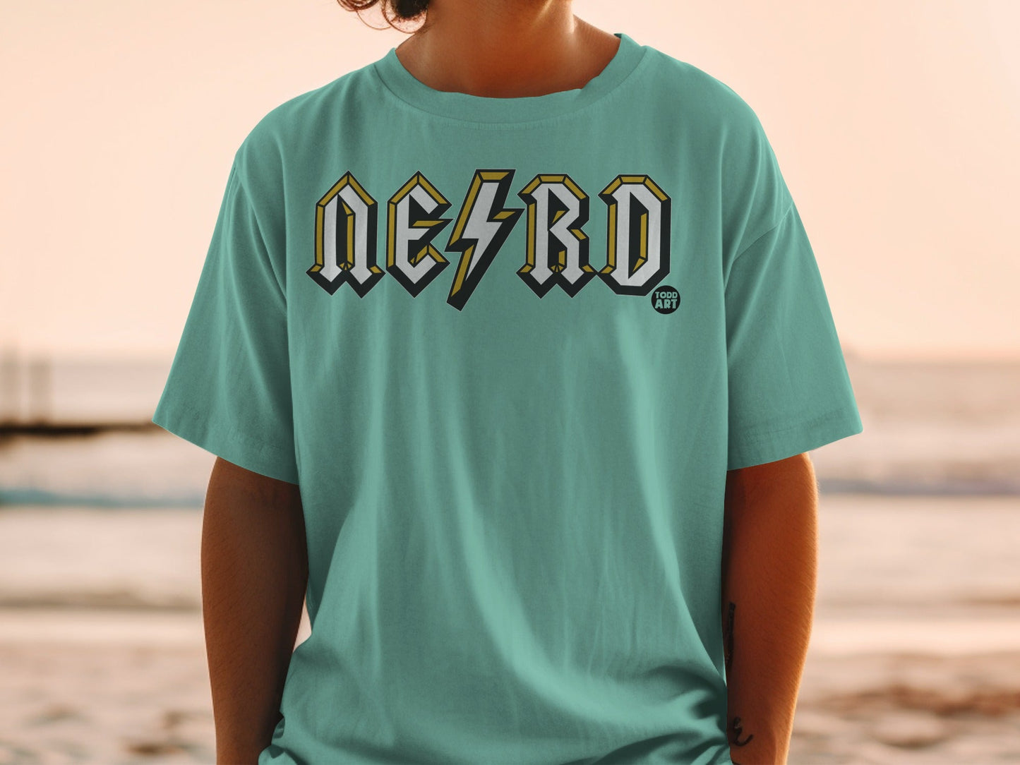 Teal t-shirt with "NERD" in a distressed, lightning bolt-like font.