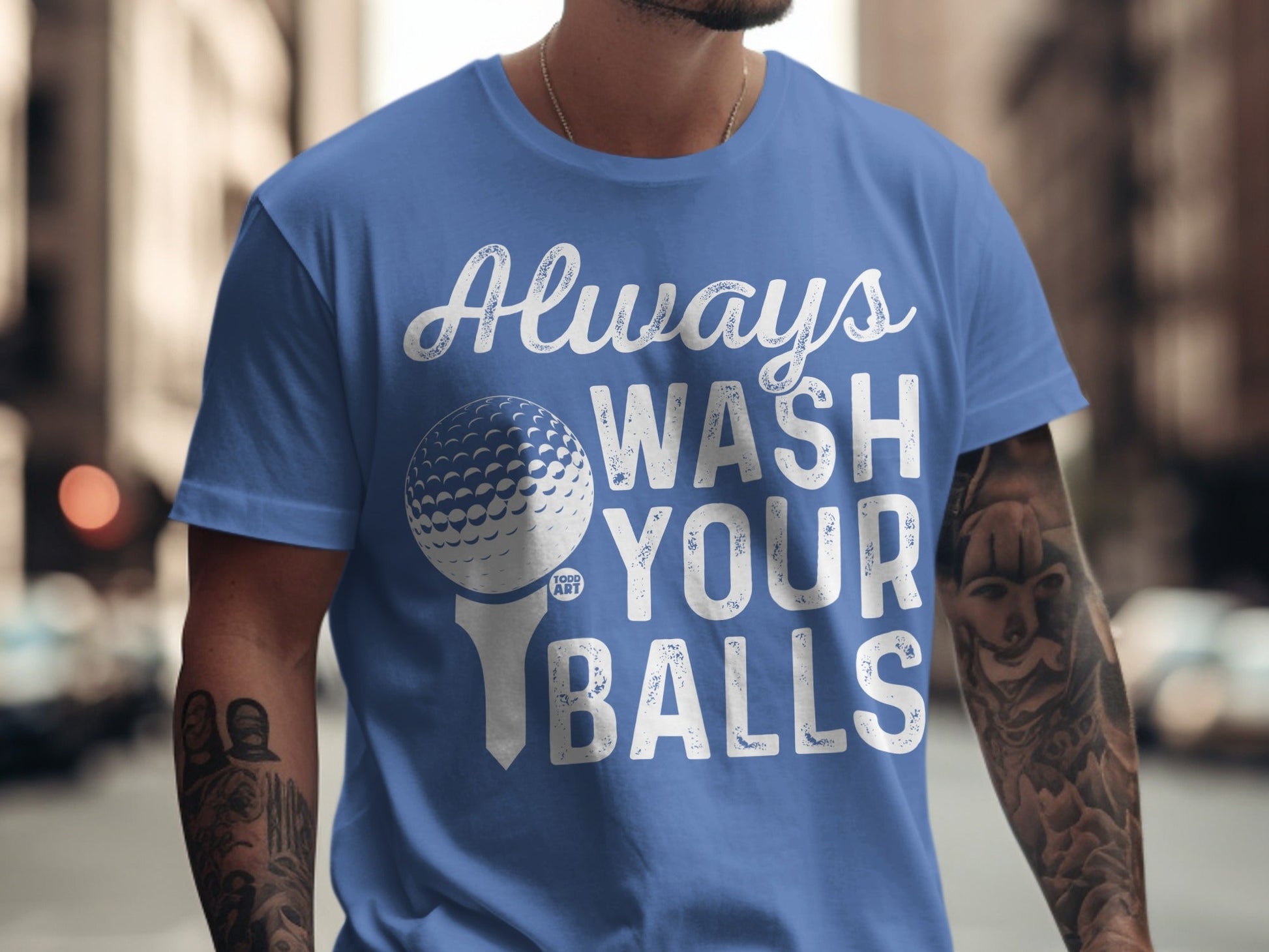 Blue t-shirt with "Always Wash Your Balls" and a golf ball logo.